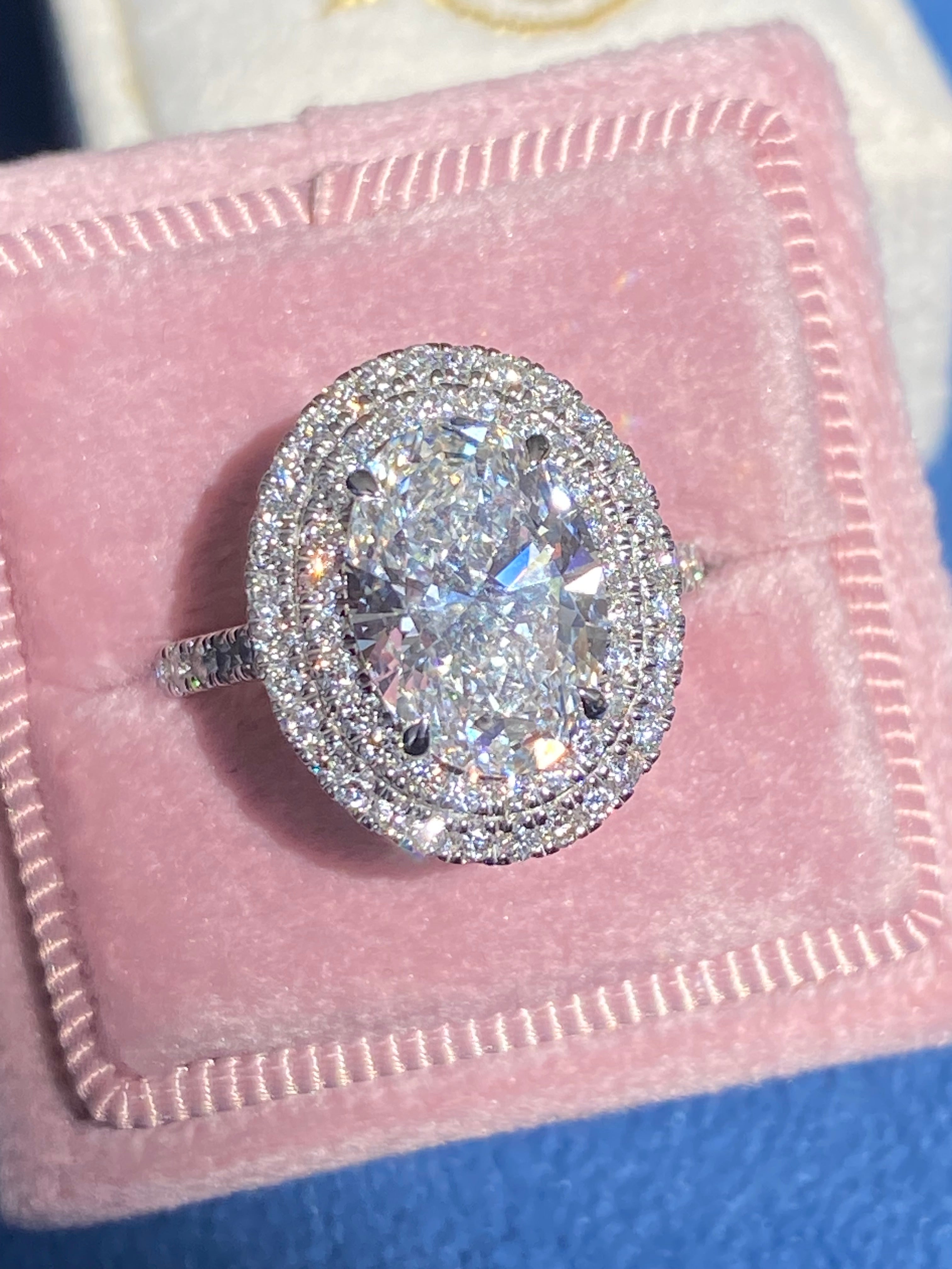 3.92 CTW Oval Cut Lab Diamond Double Halo Engagement Ring in Platinum
