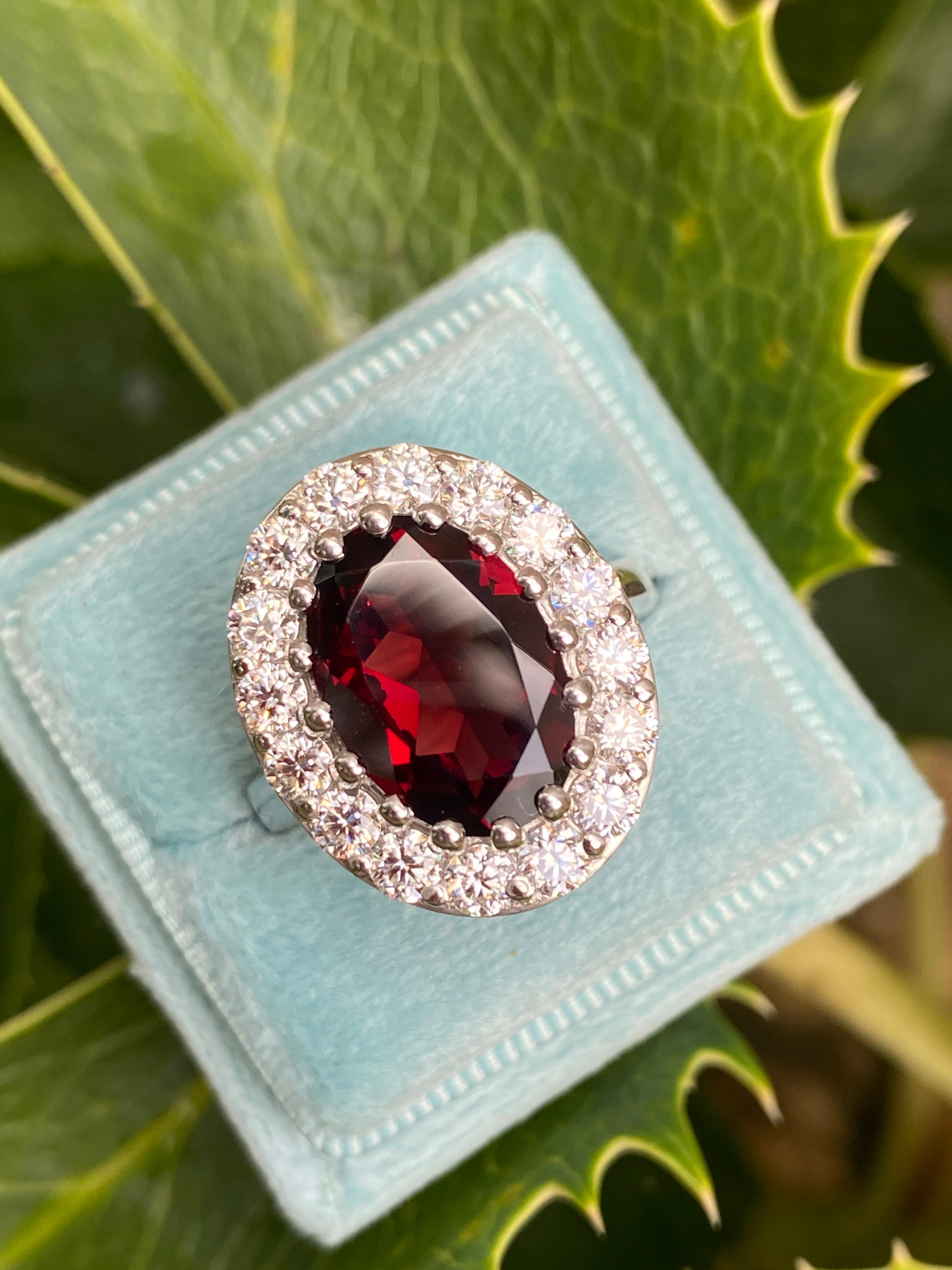 8.25 CTW Oval Cut Garnet and Moissanite Halo Cocktail Ring in Sterling Silver