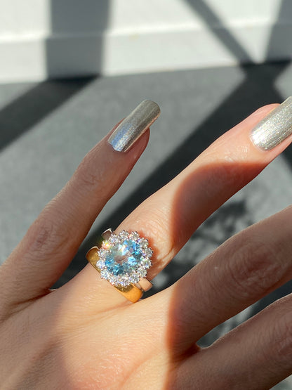 4.50 CTW Oval Cut Blue Topaz and Moissanite Halo Cluster Ring in Sterling Silver