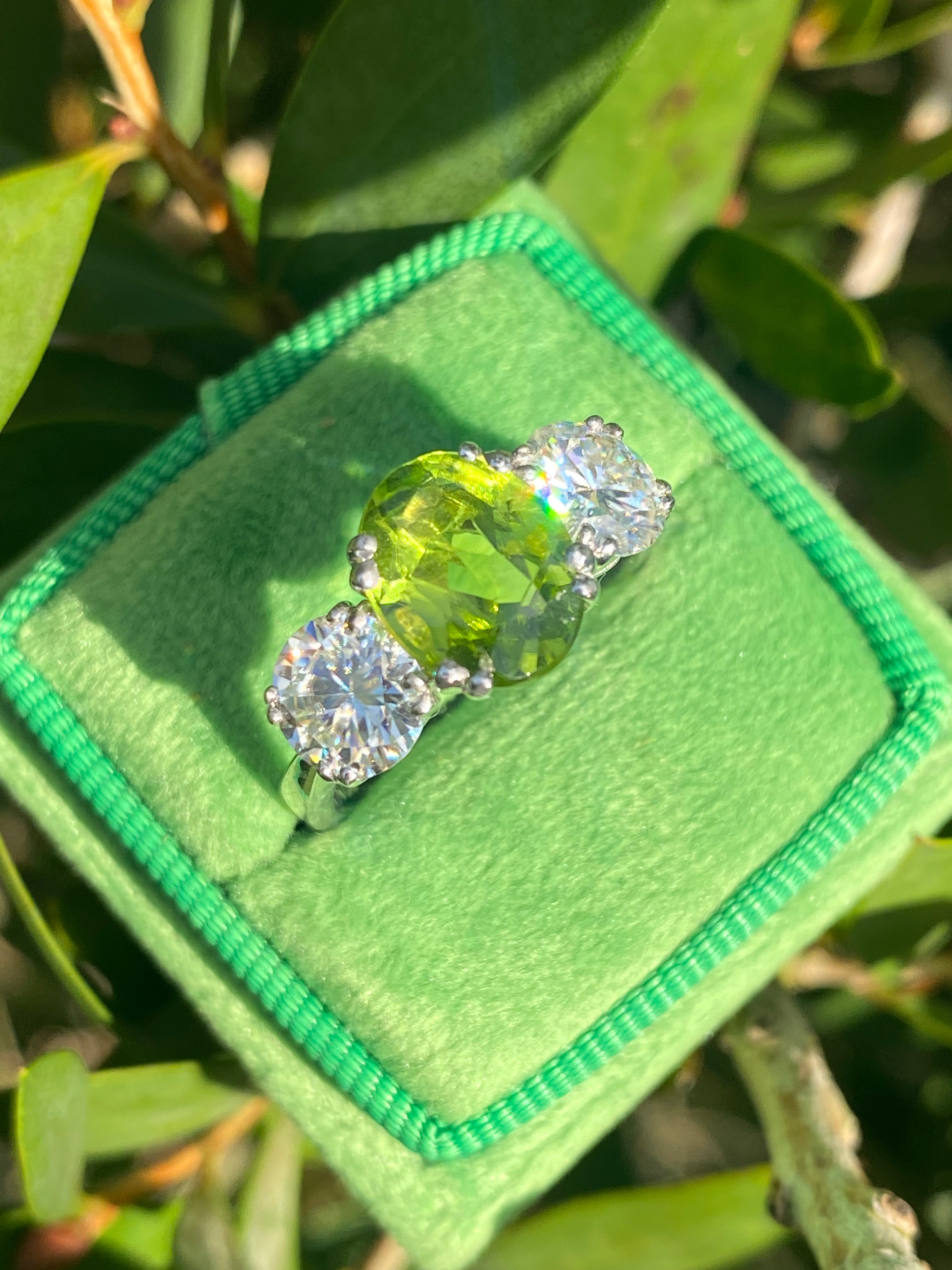 2.57 Carat Peridot and 1.84 Carat Moissanite Three Stone Ring in Sterling Silver