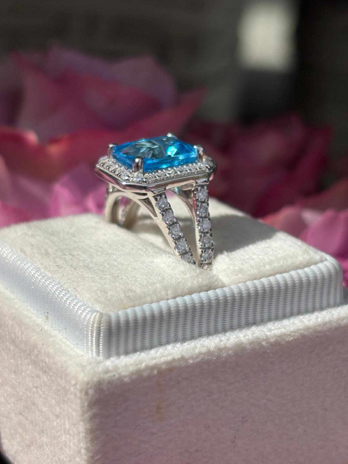 3.10 CTW Emerald Cut Moissanite and Blue Topaz Halo Ring in Sterling Silver