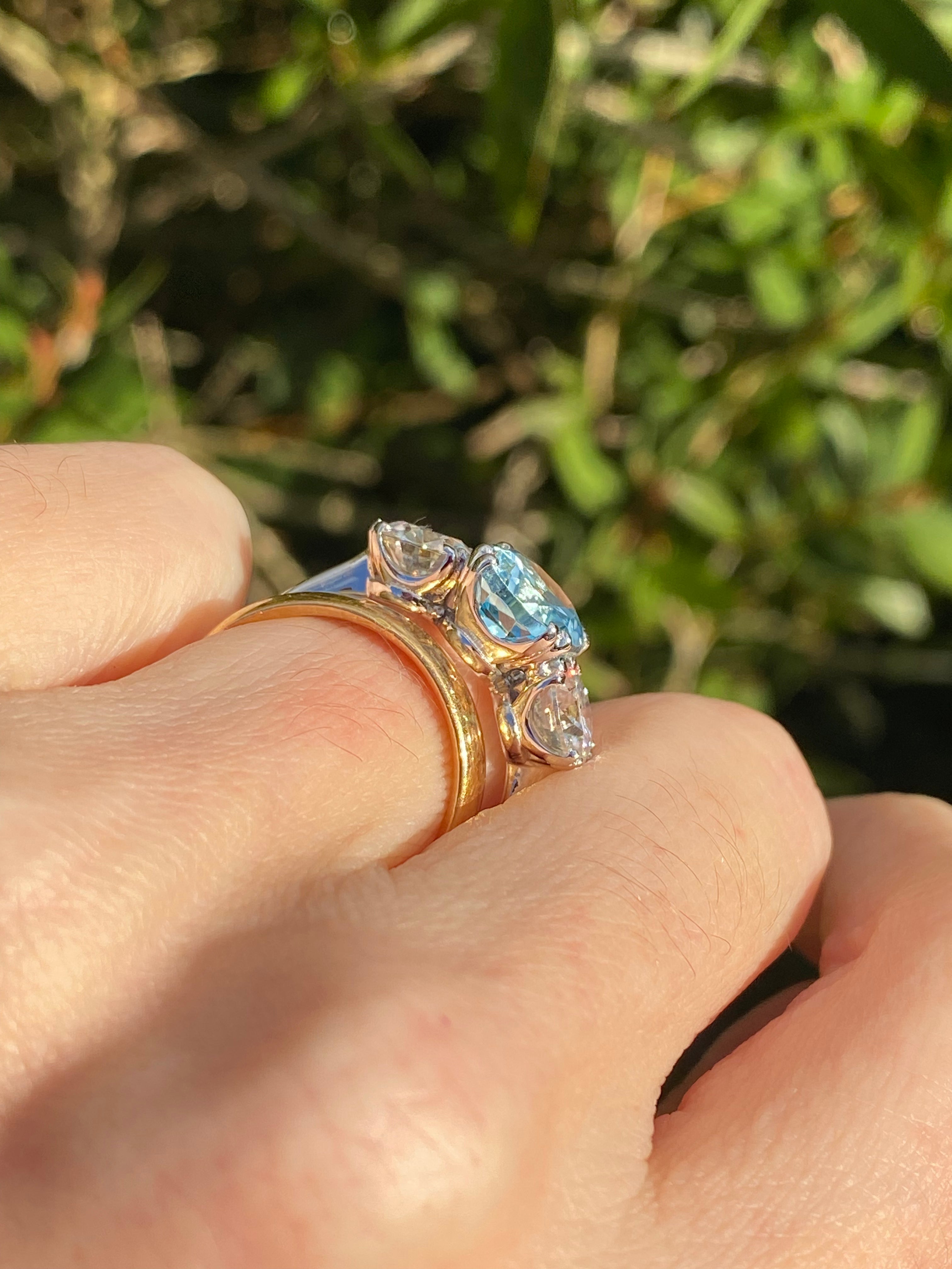 2.57 Carat Blue Topaz and 1.84 Carat Moissanite Three Stone Ring in Sterling Silver