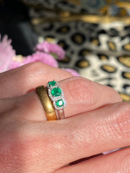 0.65ctw Emerald and Diamond Three Stone Halo Ring in Platinum