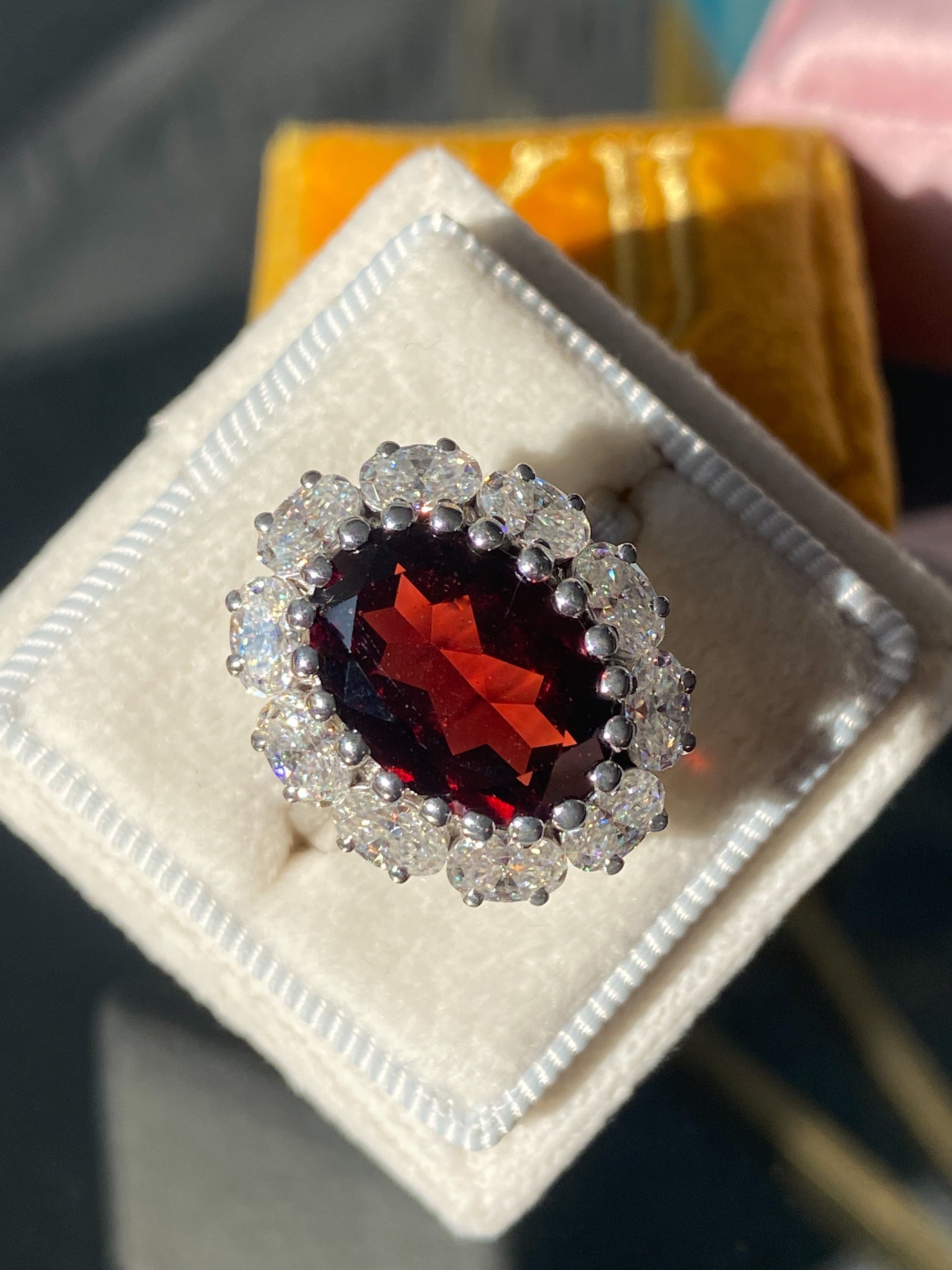 7.25 CTW Oval Cut Garnet and Moissanite Halo Cocktail Ring in Sterling Silver