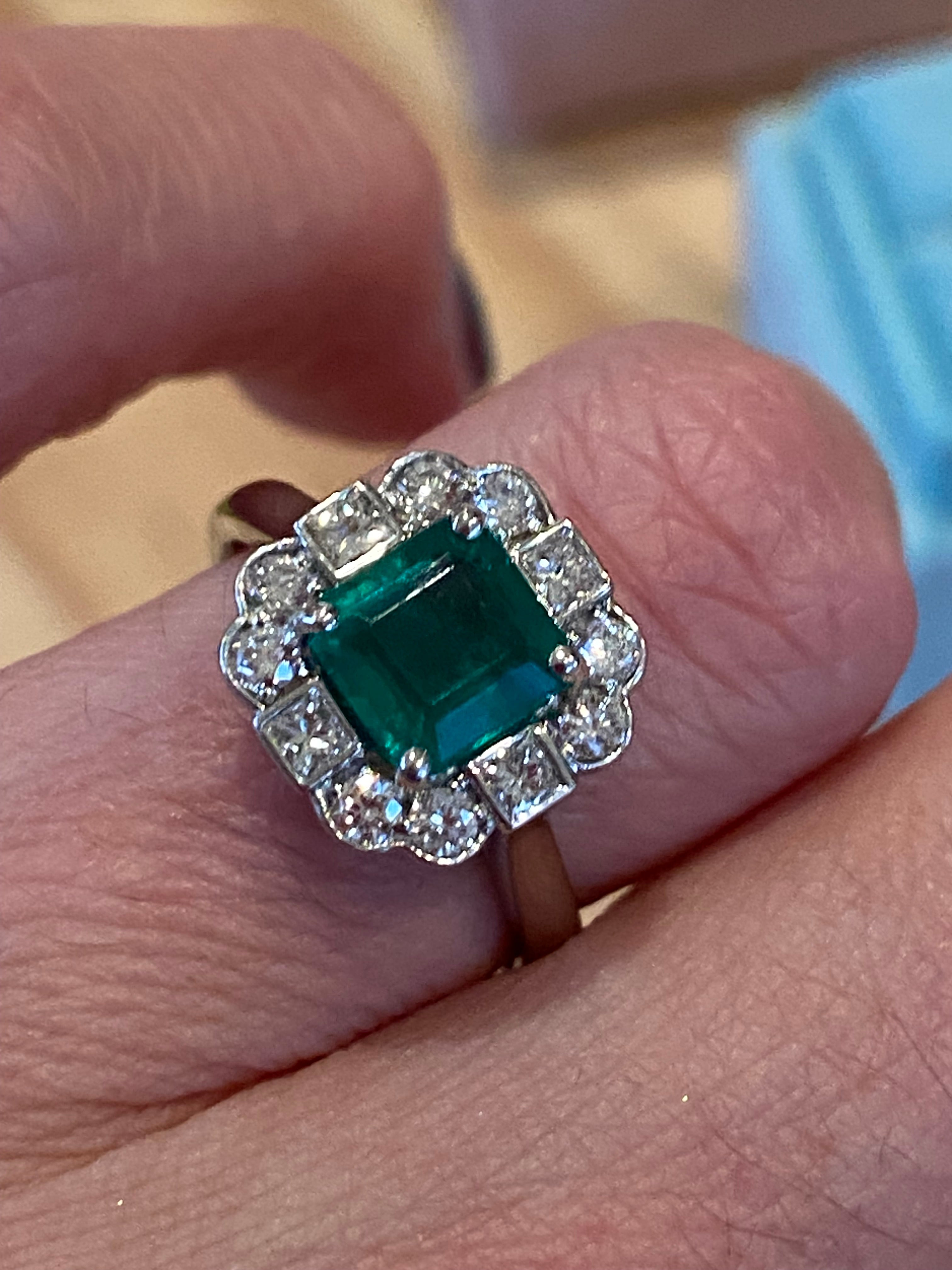 1.35 Carat Emerald Cut Emerald and 0.49 CTW Natural Diamond Halo Ring in Platinum