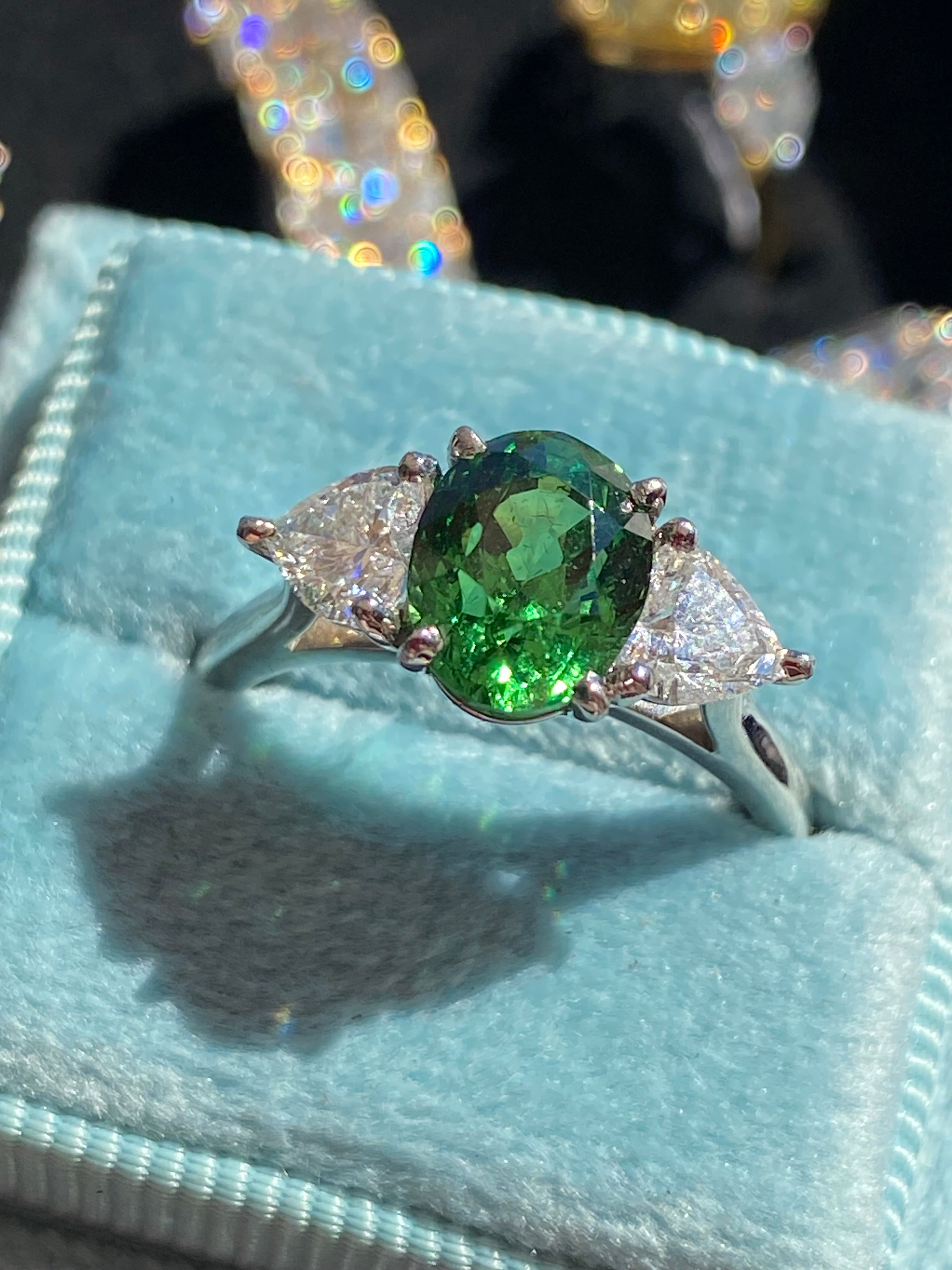2.49 Carat Tsavorite Garnet and 0.83 Carat Diamond Three Stone Engagement Ring in Platinum
