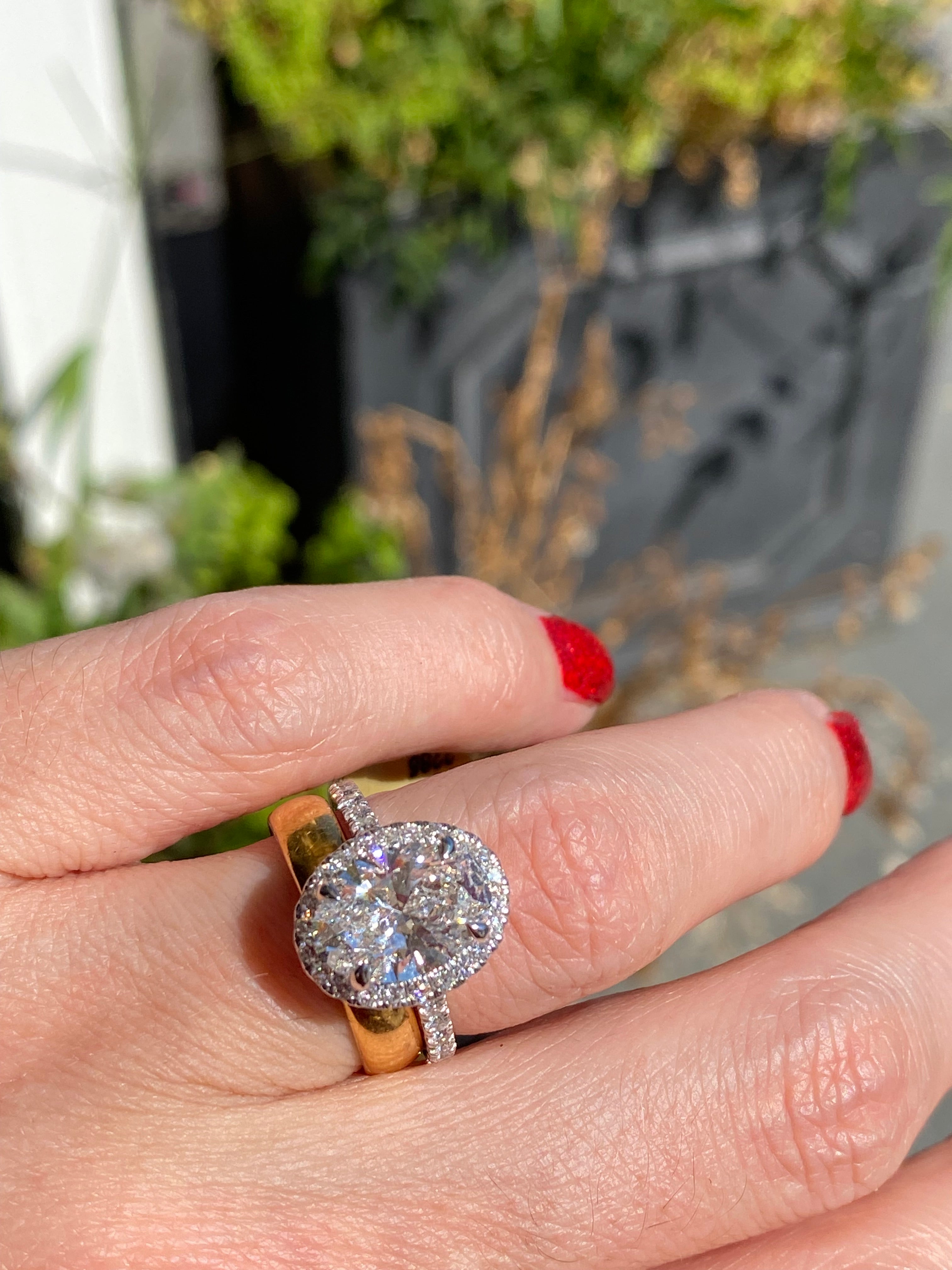 3.58 CTW Oval Cut Lab Diamond Halo Engagement Ring in Platinum