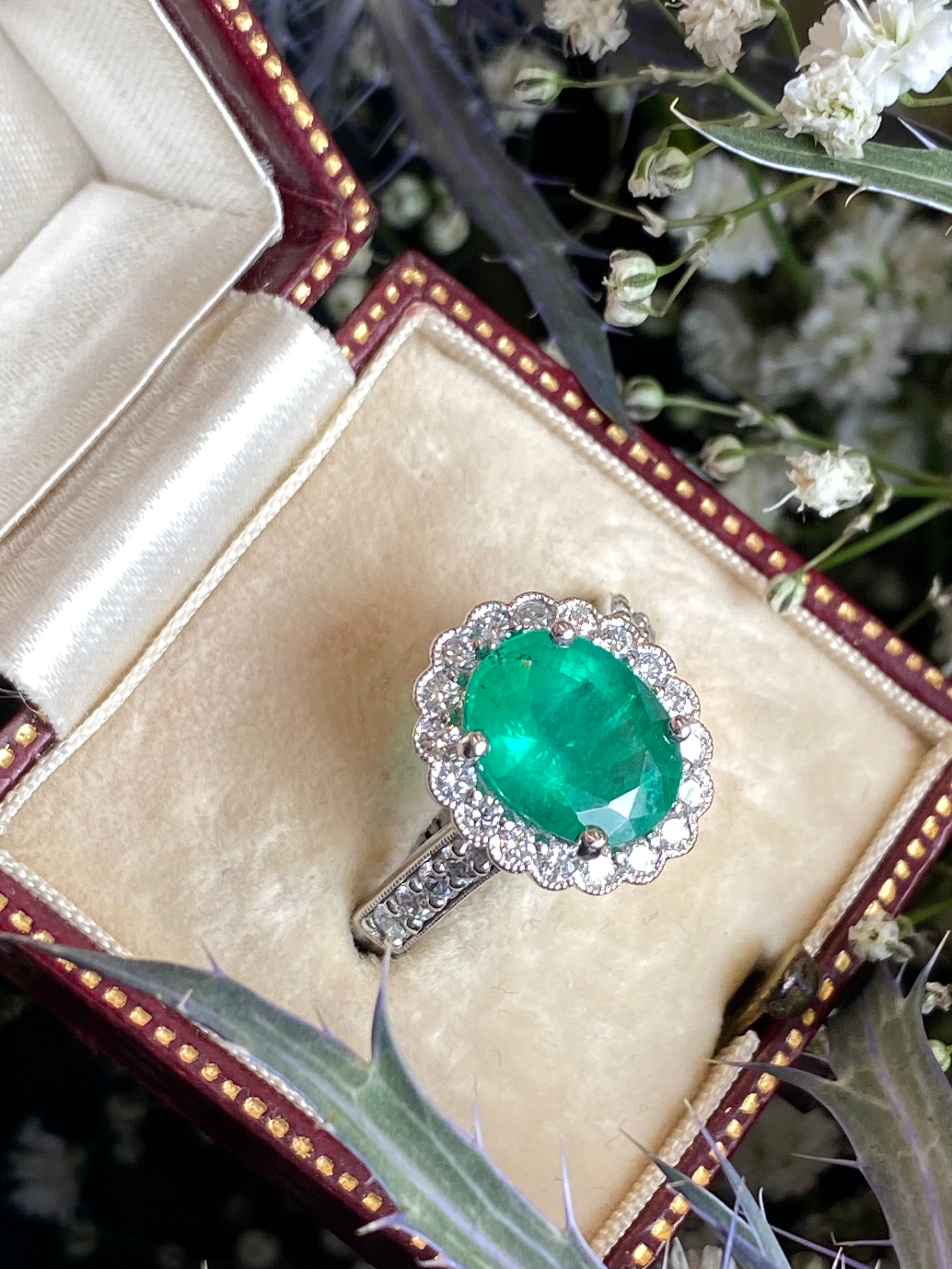 3.12 CTW Oval Cut Emerald and Natural Diamond Halo Ring in Platinum