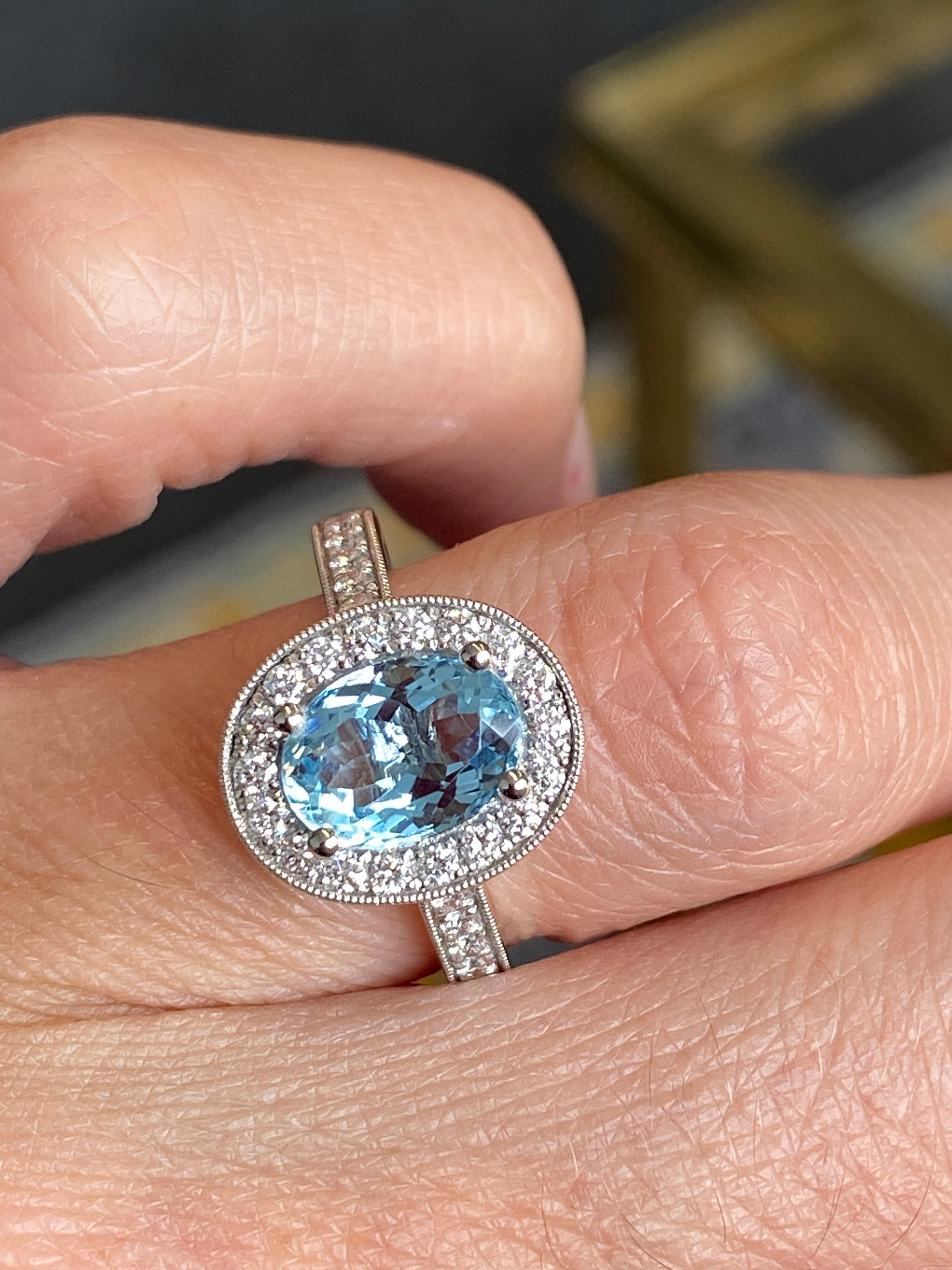 2.33 CTW Oval Cut Aquamarine and Natural Diamond Halo Engagement Ring in 18ct White Gold