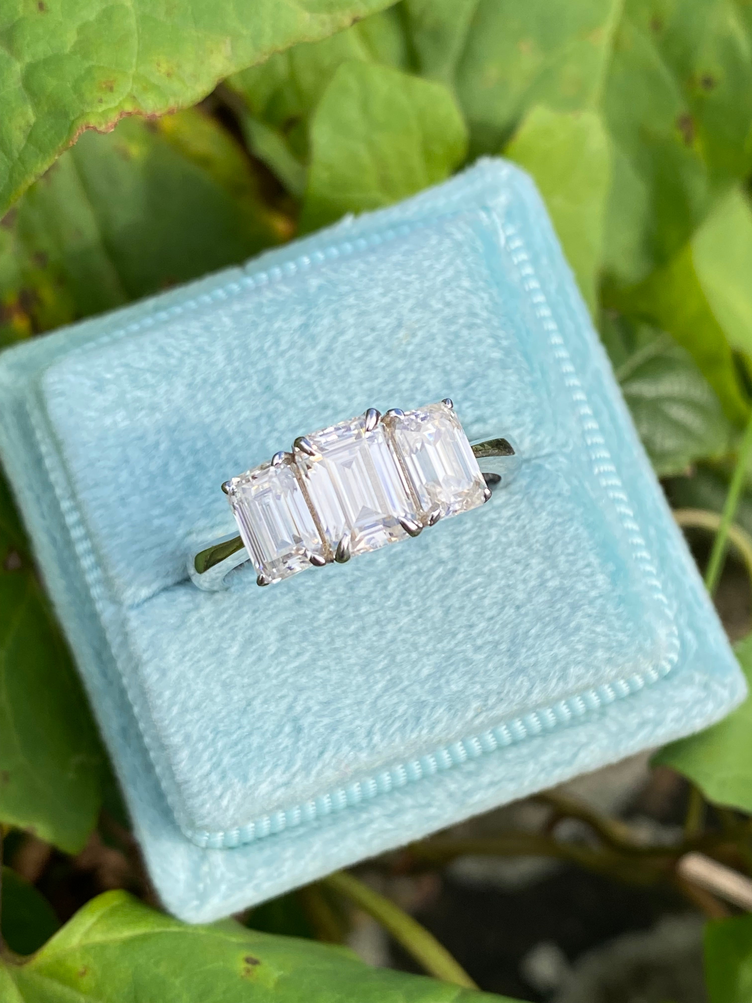 2.00 CTW Emerald Cut Moissanite Three Stone Engagement Ring in Sterling Silver