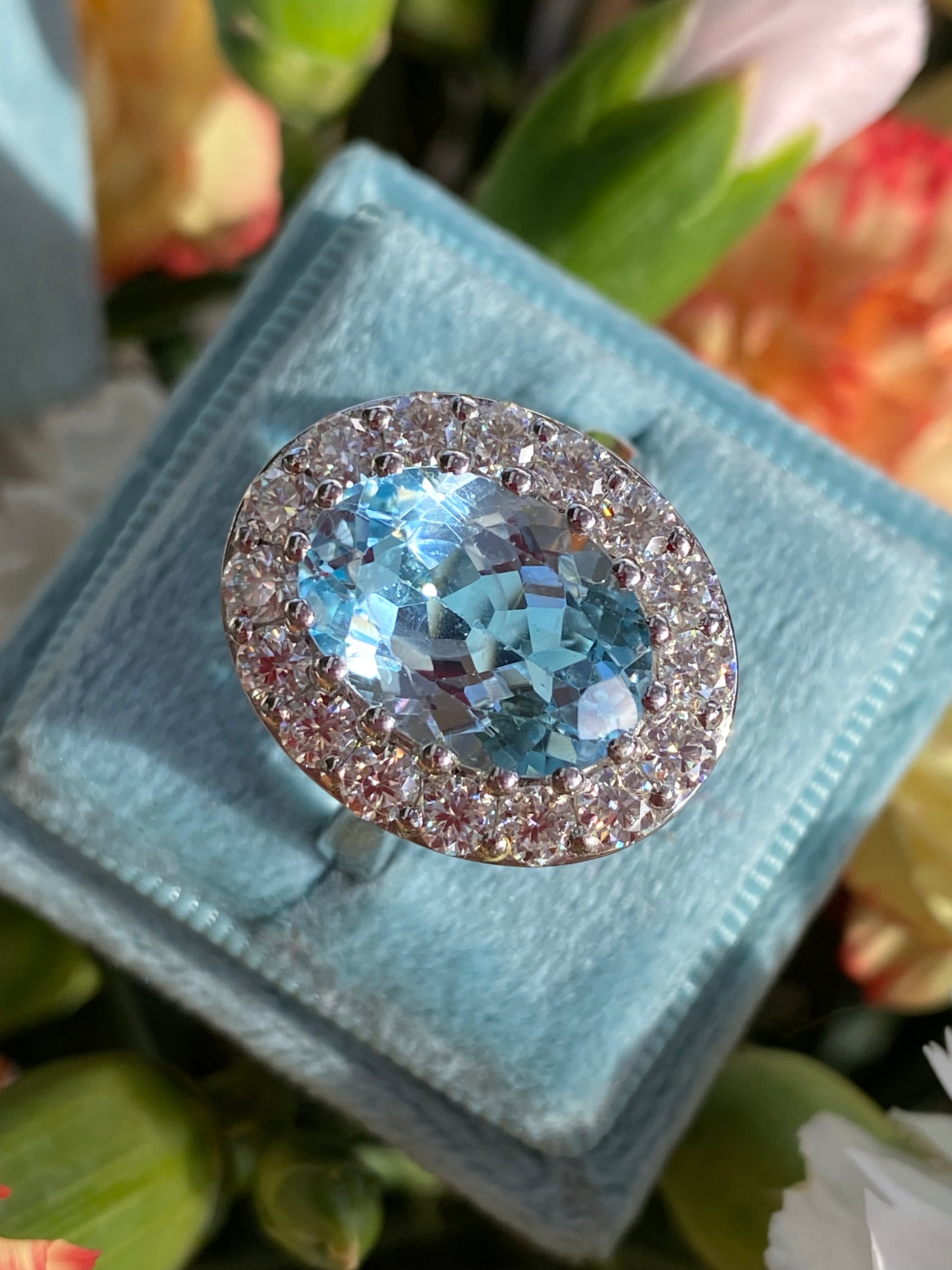 9.60 CTW Oval Cut Blue Topaz and Moissanite Halo Cocktail Ring in Sterling Silver