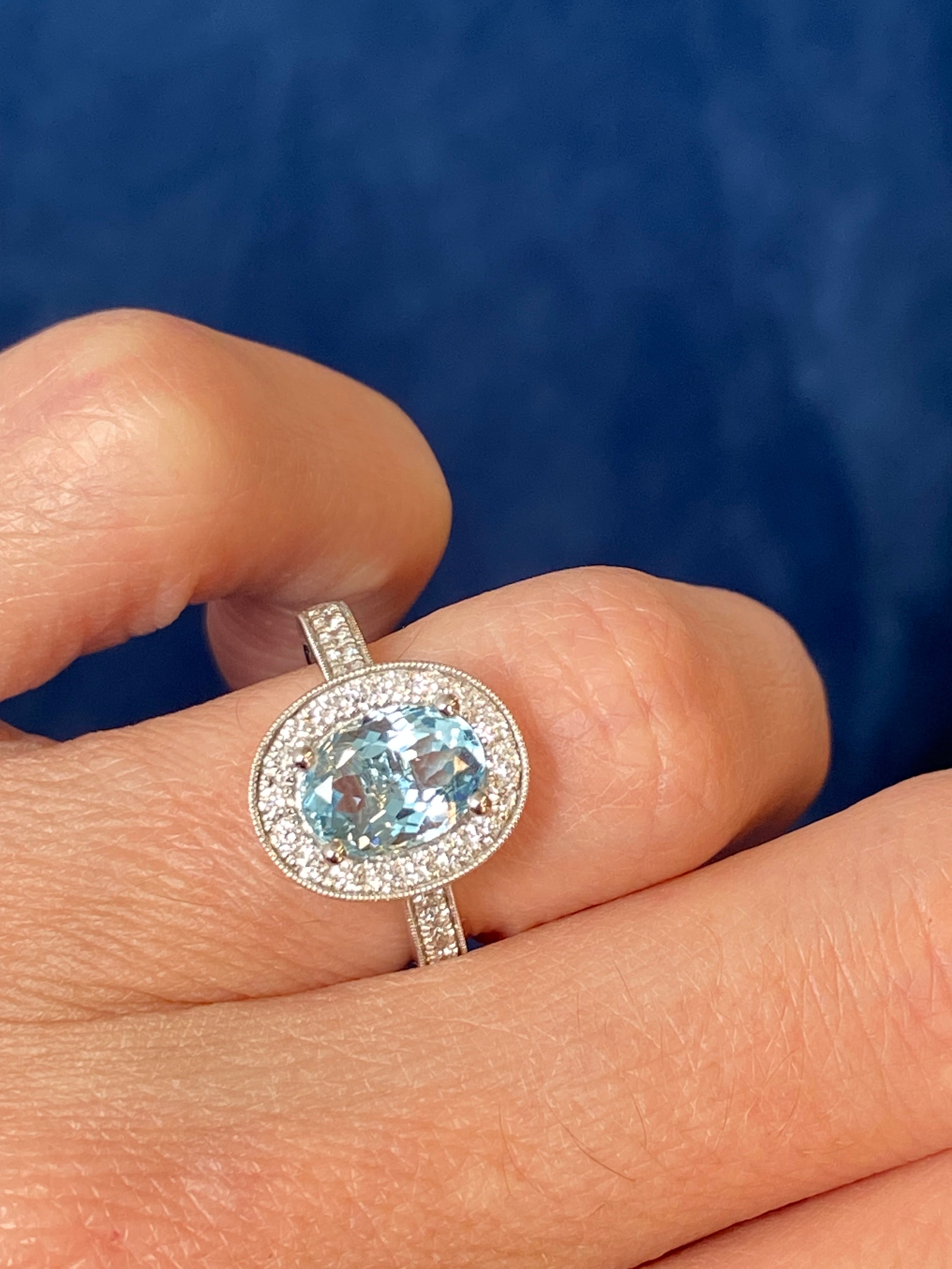 2.33 CTW Oval Cut Aquamarine and Natural Diamond Halo Engagement Ring in 18ct White Gold