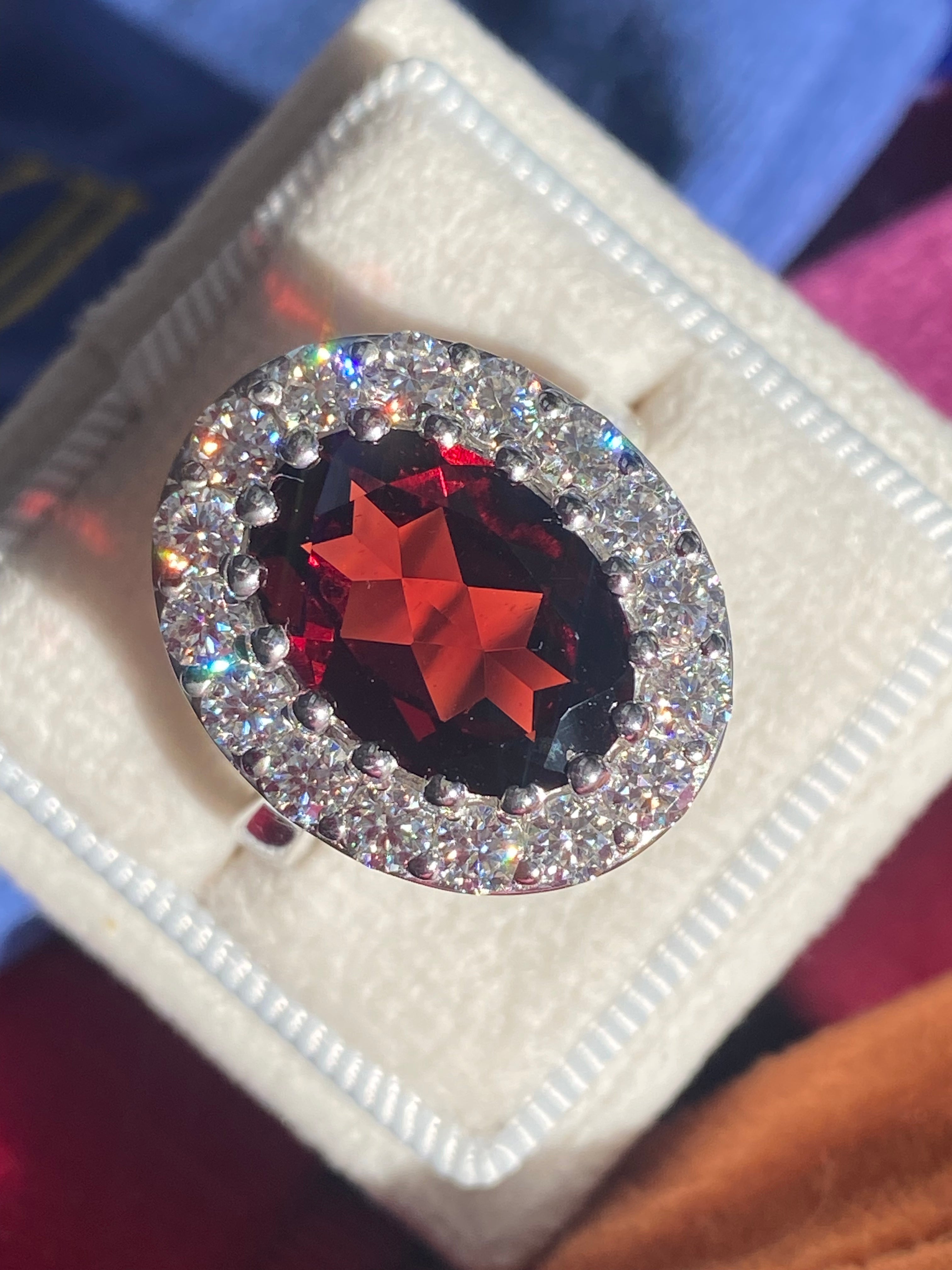 8.25 CTW Oval Cut Garnet and Moissanite Halo Cocktail Ring in Sterling Silver