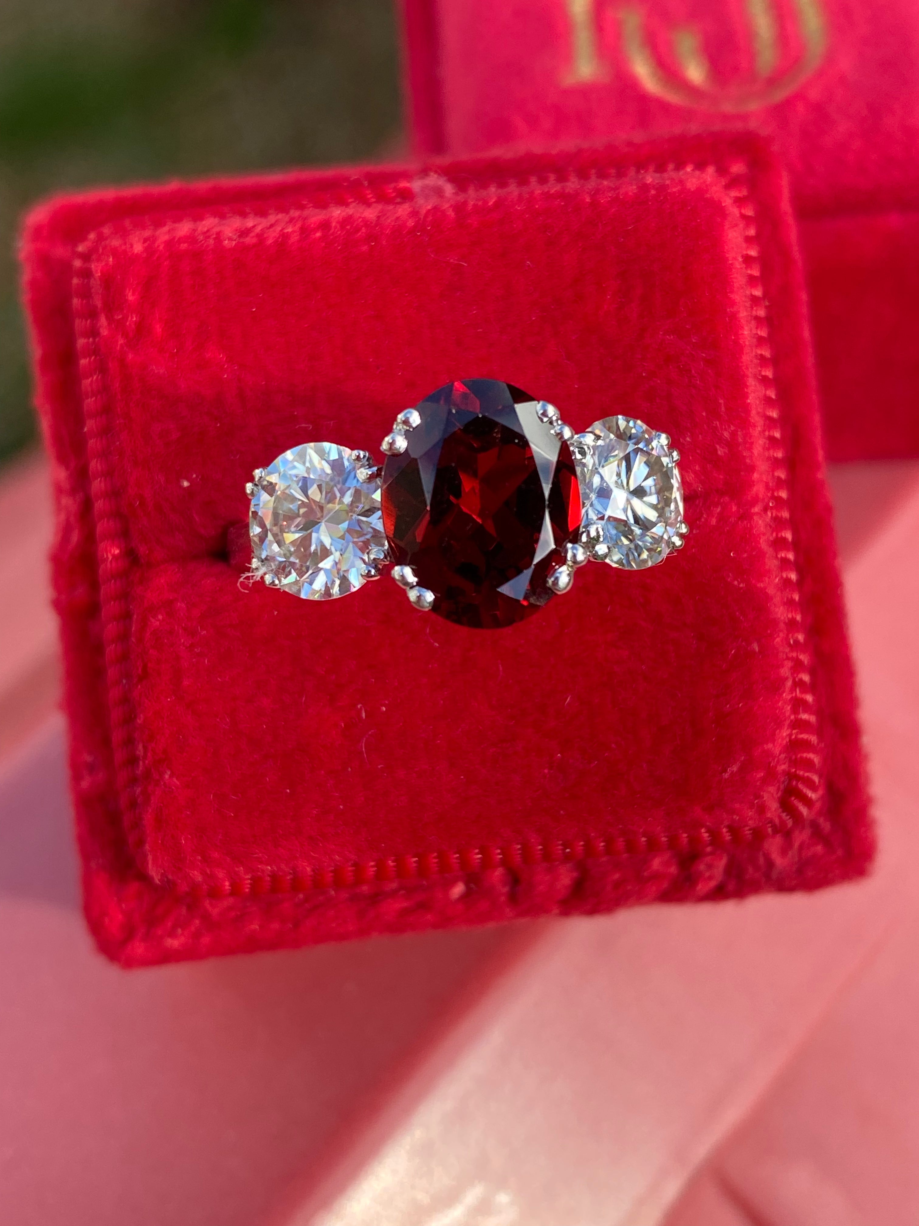 2.57 Carat Garnet and 1.84 Carat Moissanite Three Stone Ring in Sterling Silver