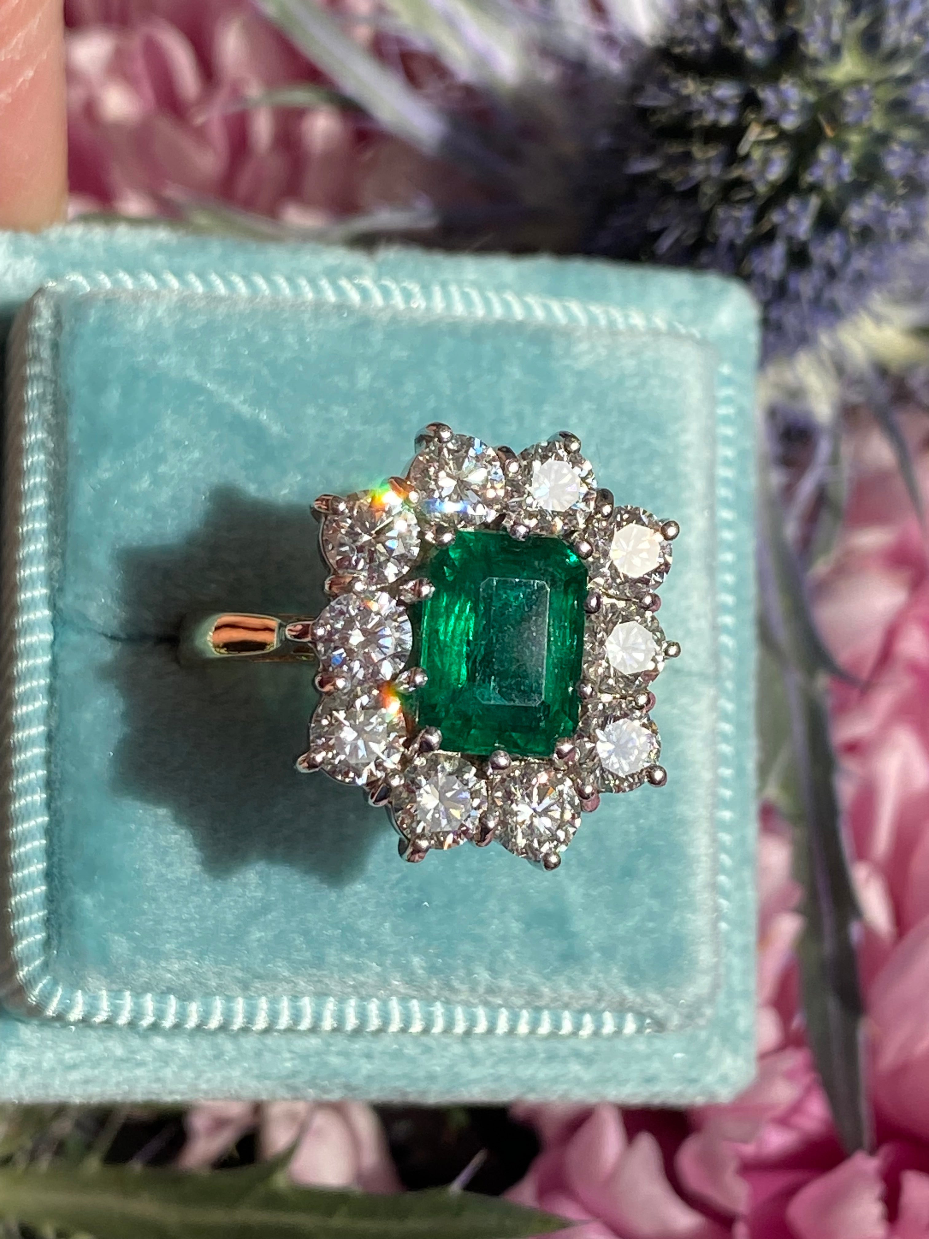 Outrageously Fantastic 4.17 CTW Emerald and Diamond Halo Ring in 18ct White and Yellow Gold