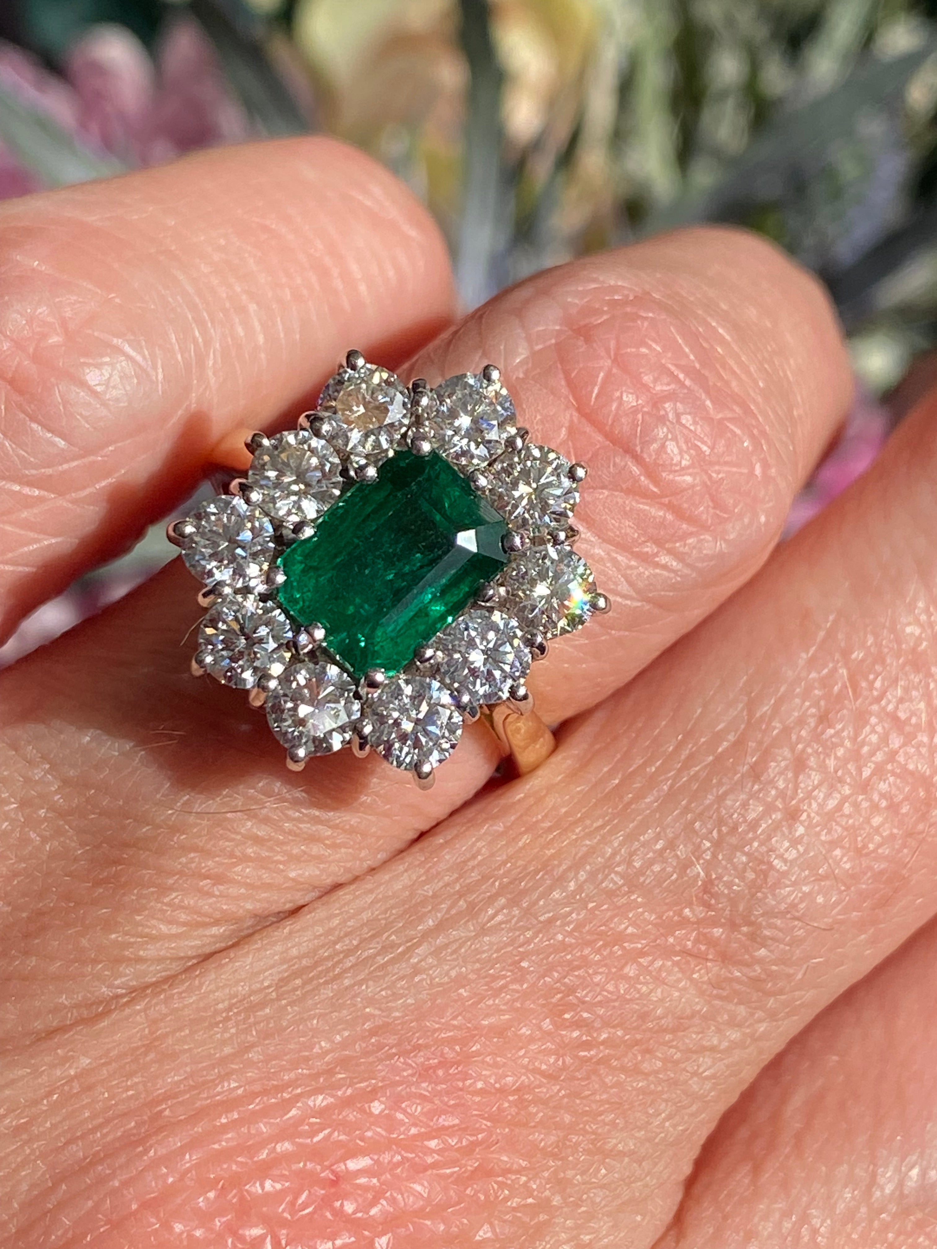 Outrageously Fantastic 4.17 CTW Emerald and Diamond Halo Ring in 18ct White and Yellow Gold
