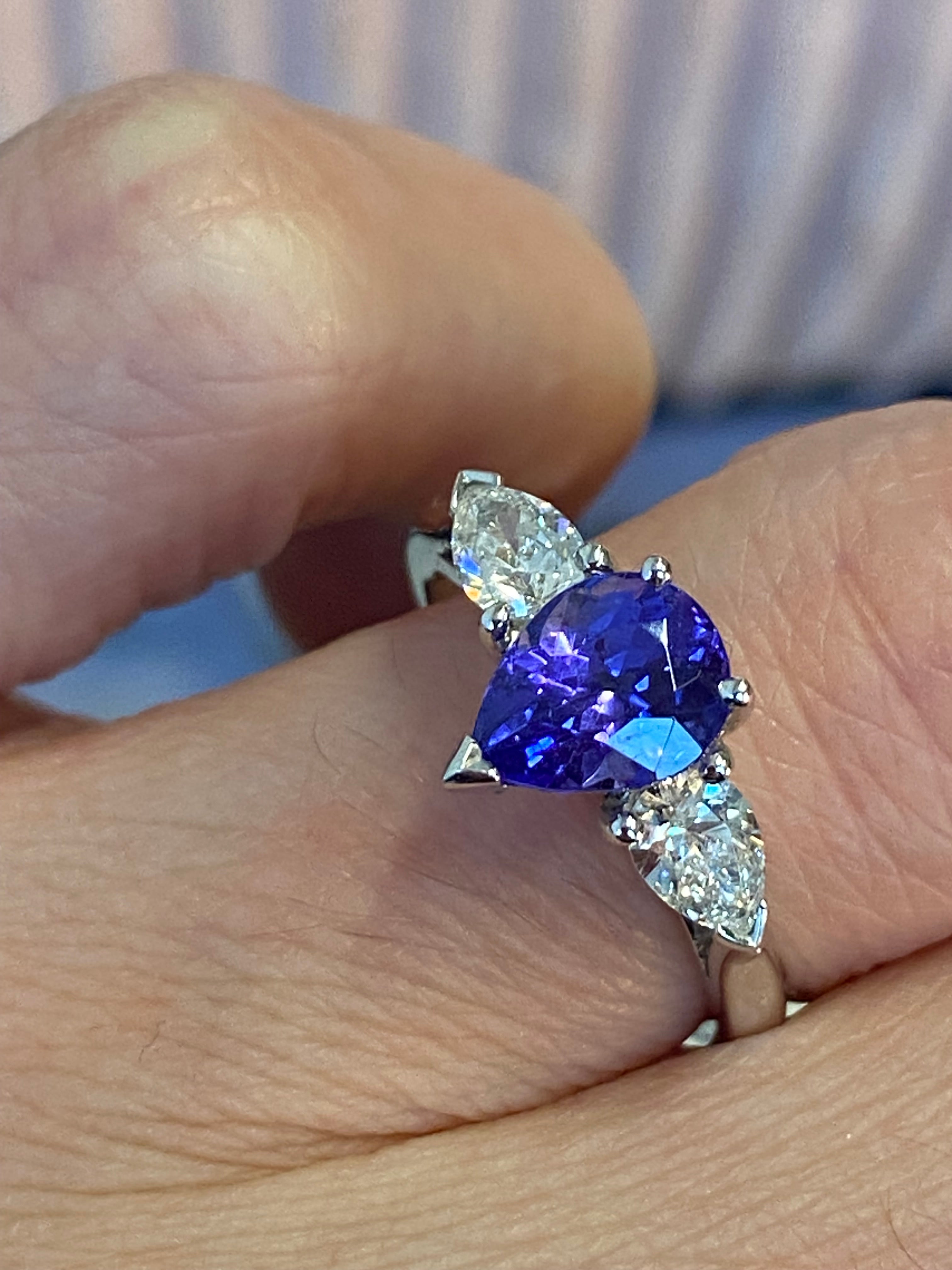 2.47 CTW Pear Cut Tanzanite and Natural Diamond Three Stone Ring in Platinum