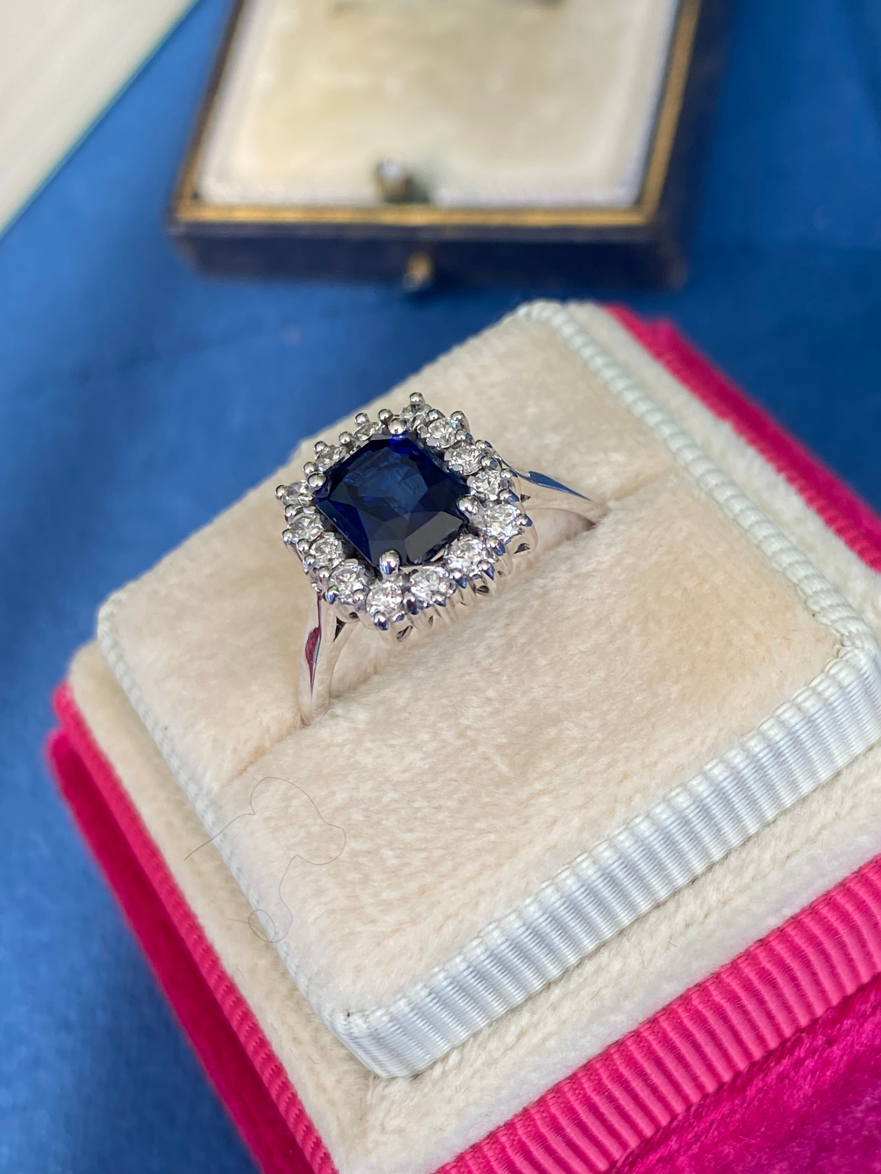 Vintage 2.05 Carat Sapphire and Natural Diamond Halo Ring in Platinum