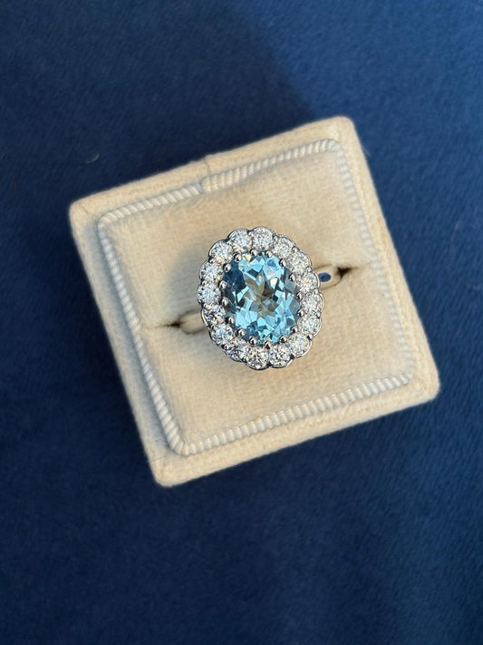 4.50 CTW Oval Cut Blue Topaz and Moissanite Halo Cocktail Ring