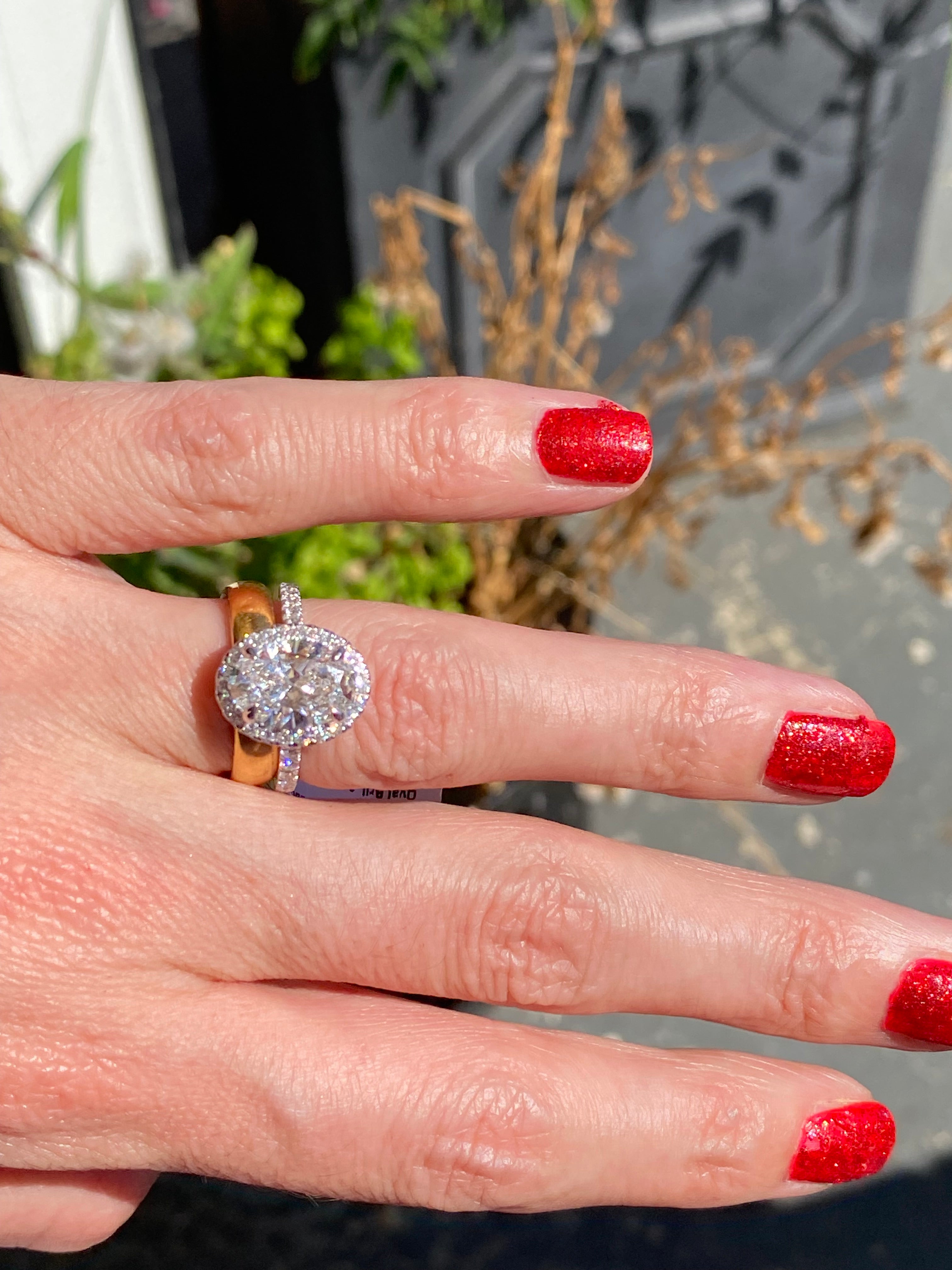 3.58 CTW Oval Cut Lab Diamond Halo Engagement Ring in Platinum