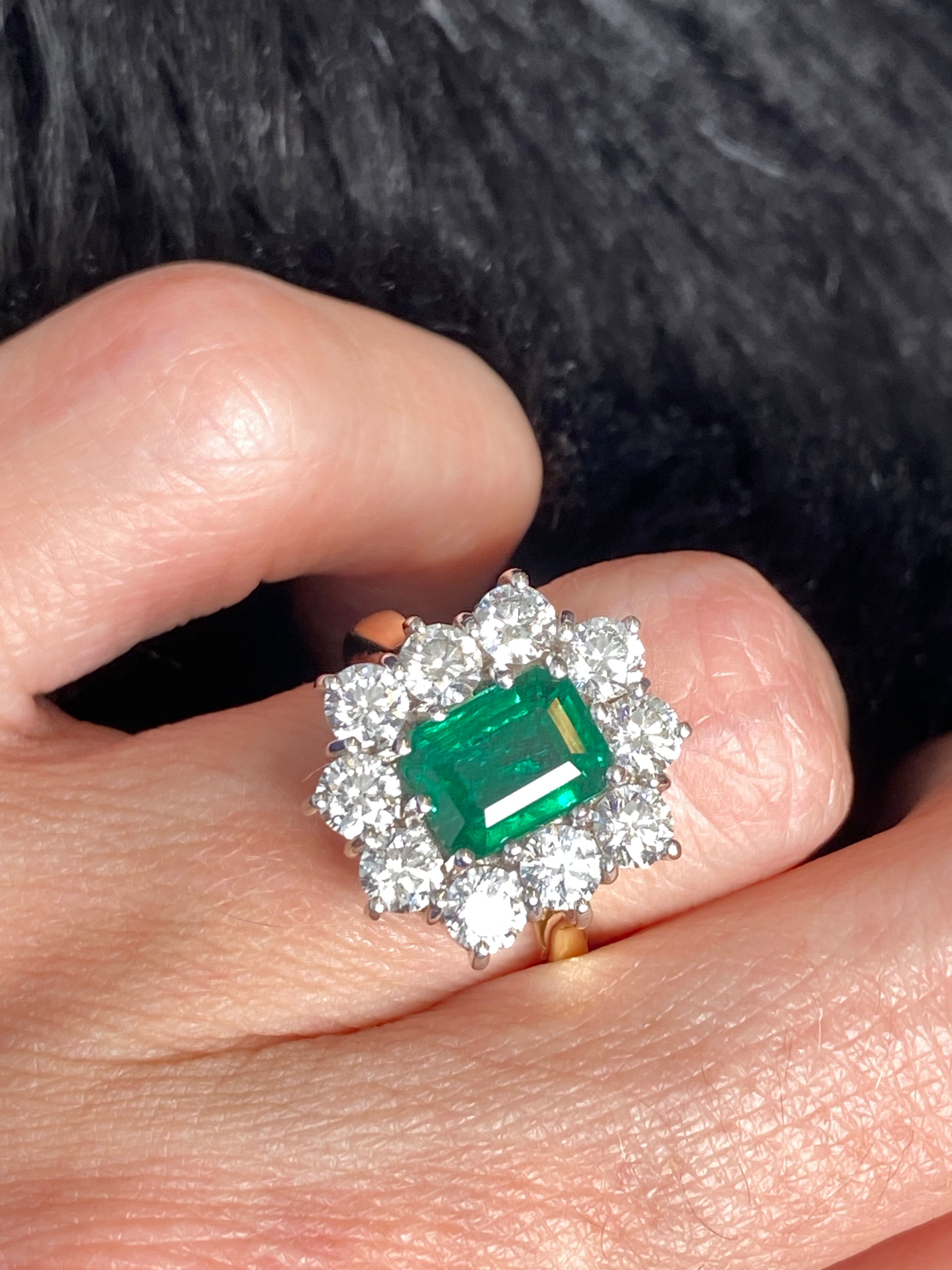 Outrageously Fantastic 4.17 CTW Emerald and Diamond Halo Ring in 18ct White and Yellow Gold