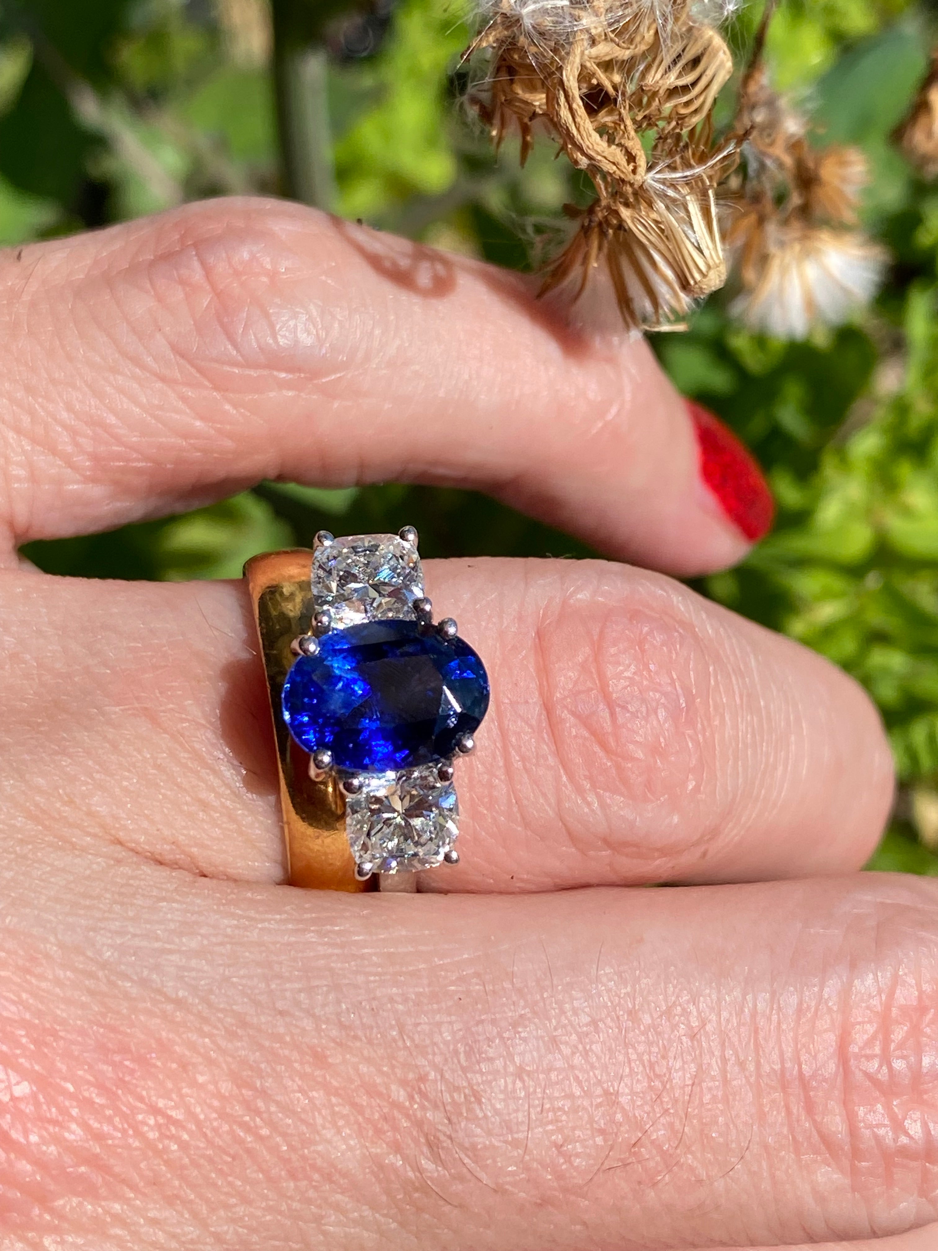 4.33 CTW Blue Ceylon Sapphire and Natural Diamond Three Stone Engagement Ring in Platinum