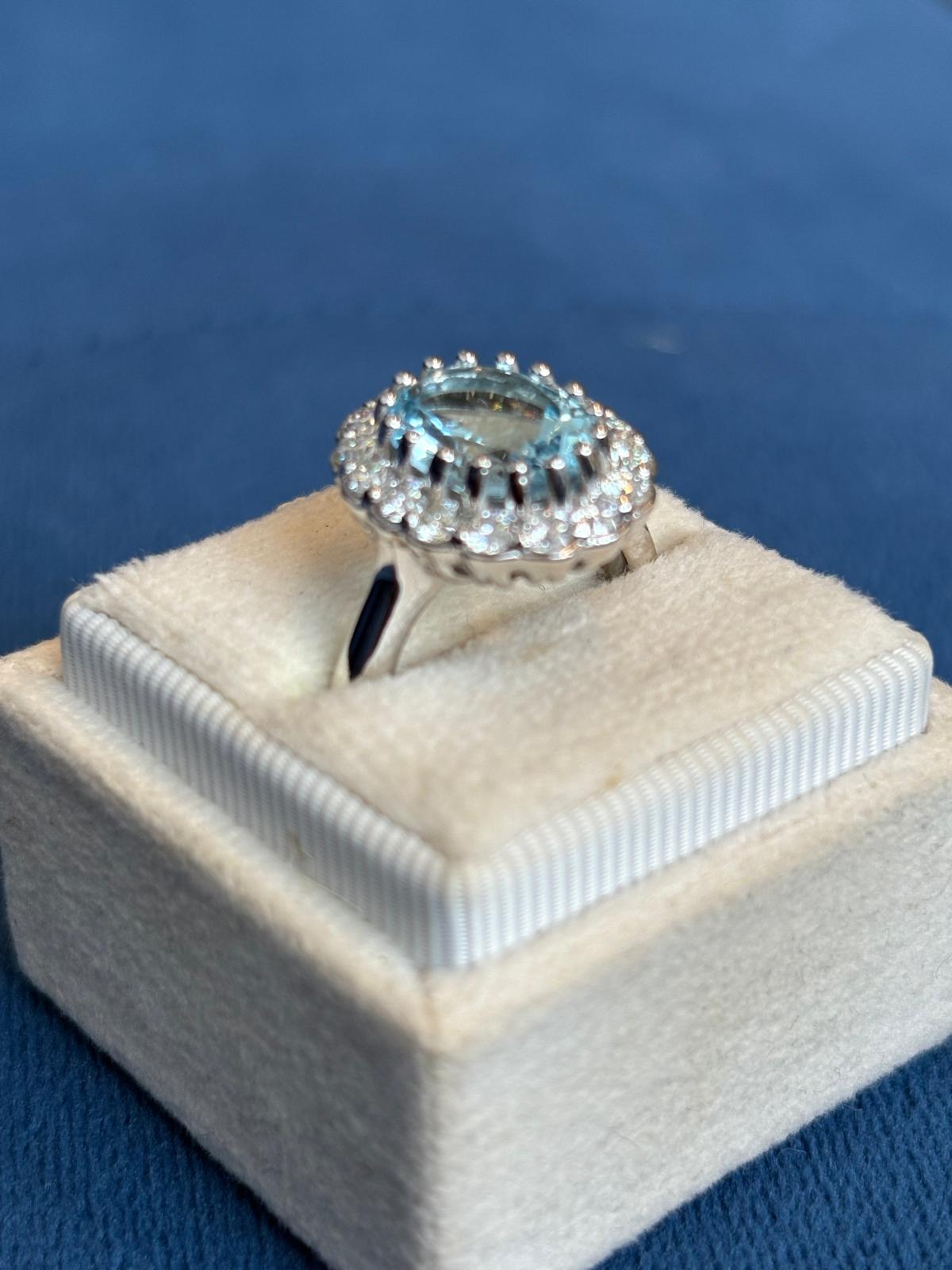 5.50 CTW Oval Cut Blue Topaz and Moissanite Halo Cocktail Ring