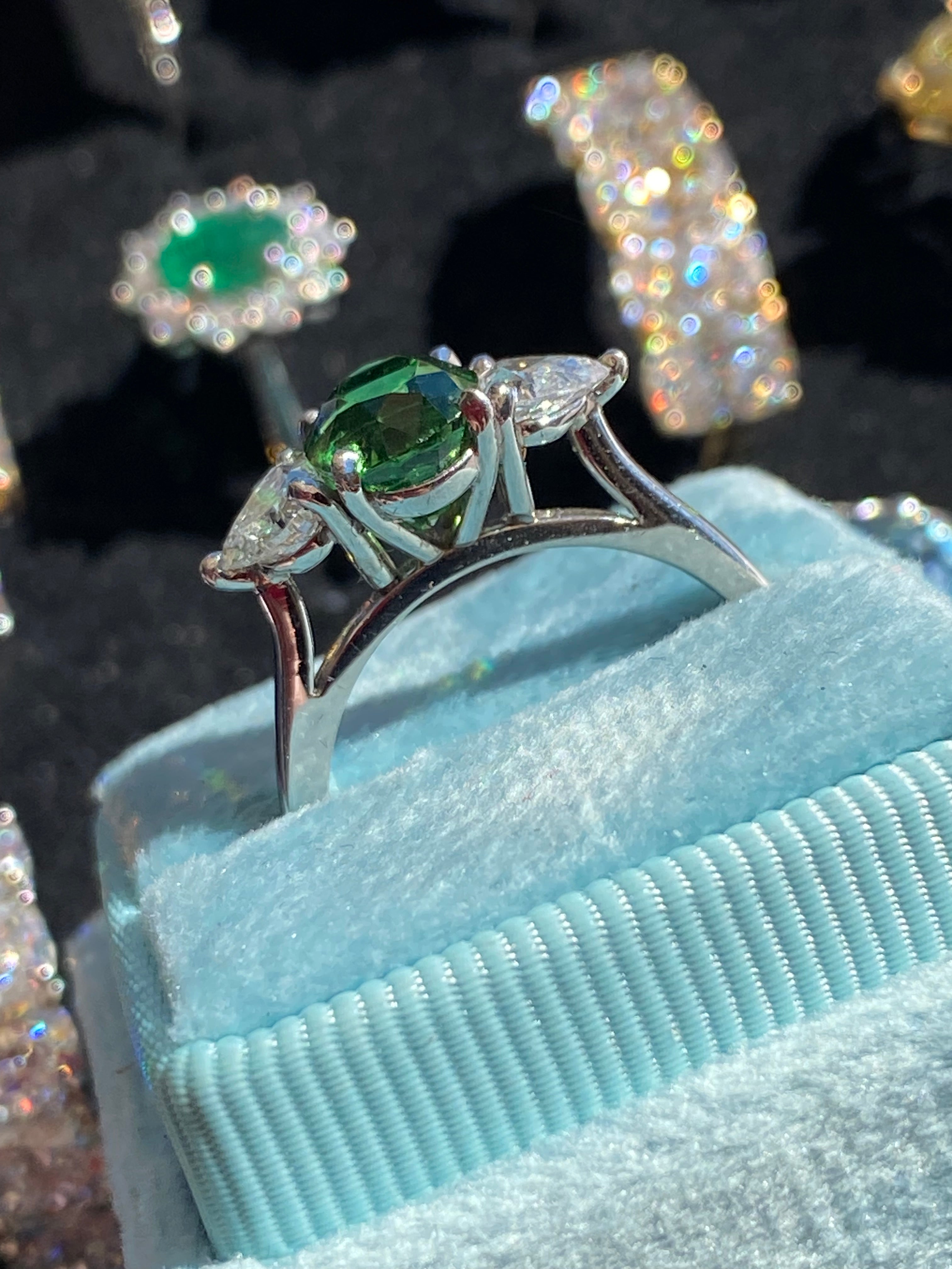 2.49 Carat Tsavorite Garnet and 0.83 Carat Diamond Three Stone Engagement Ring in Platinum