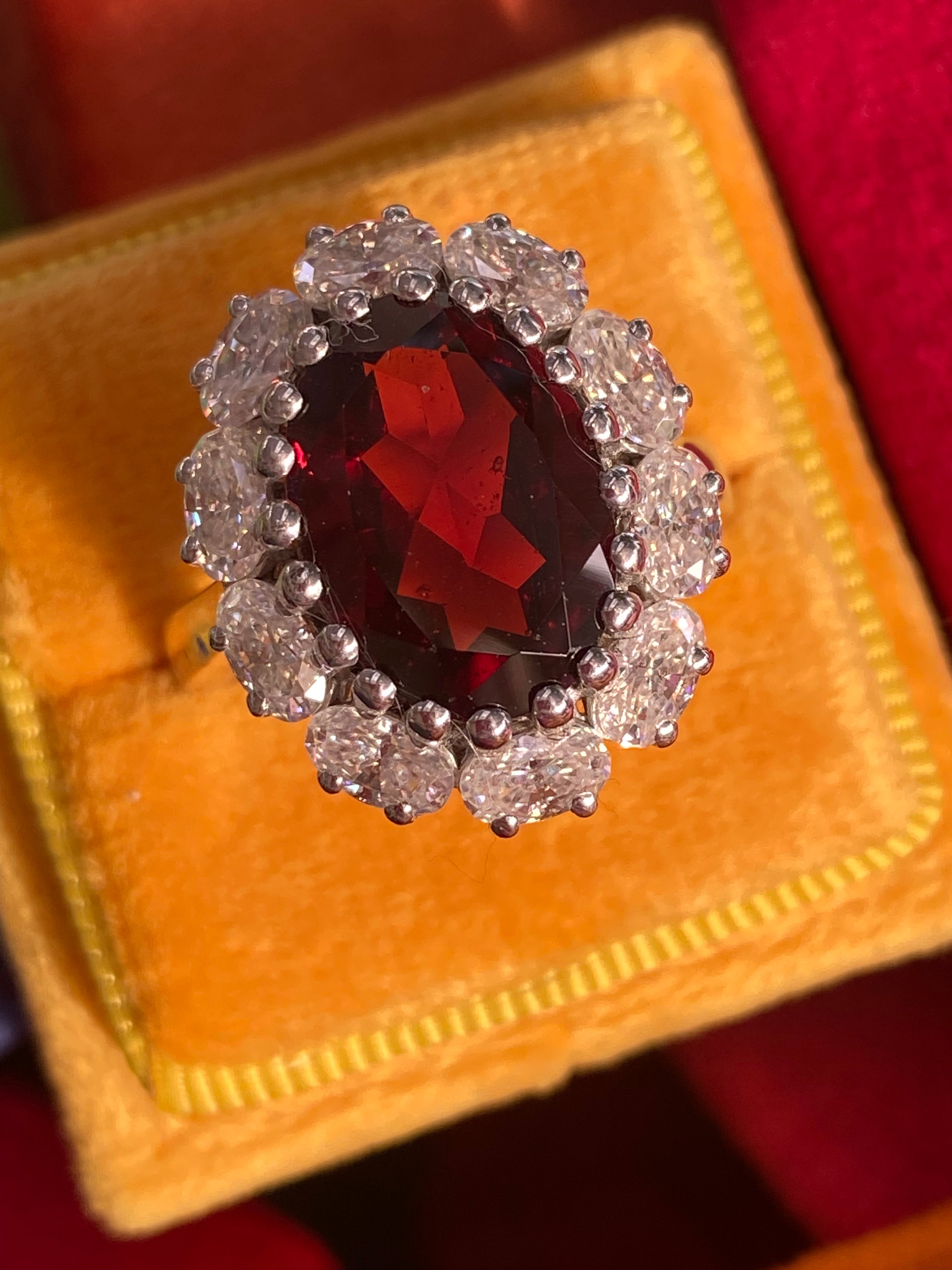 8.17 CTW Oval Cut Garnet and Moissanite Halo Cocktail Ring
