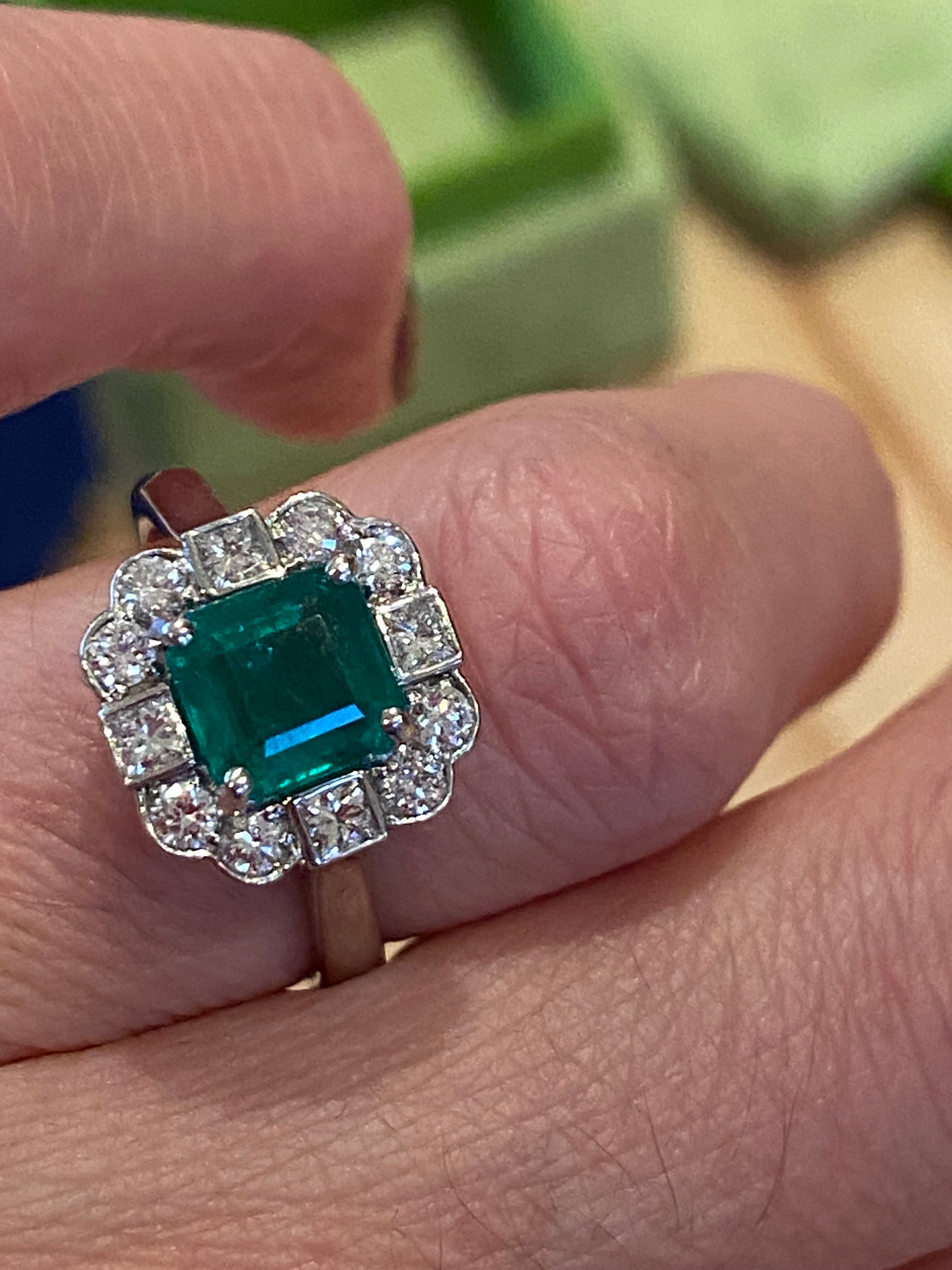 1.35 Carat Emerald Cut Emerald and 0.49 CTW Natural Diamond Halo Ring in Platinum