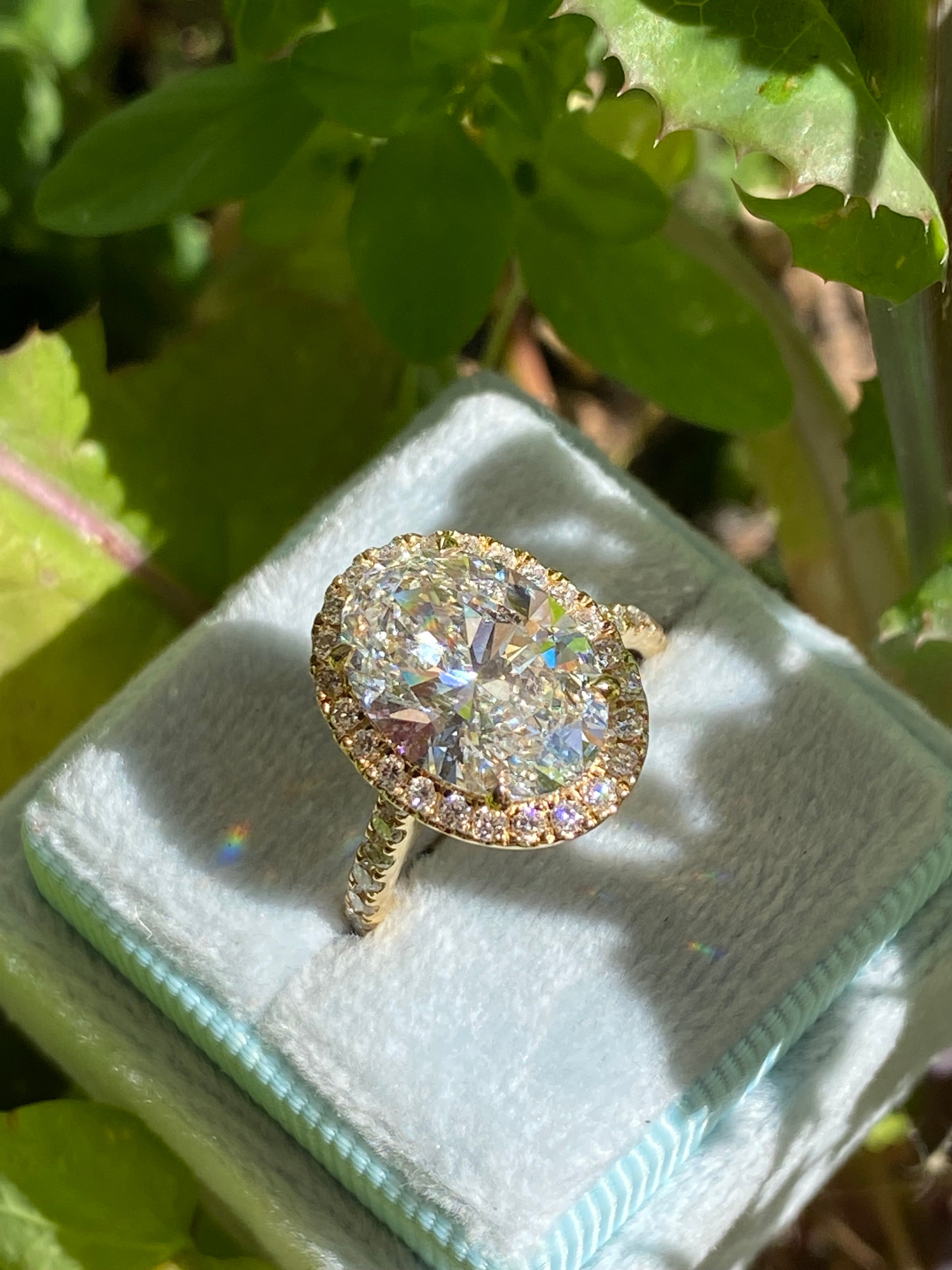 4.59 CTW Oval Cut Lab Diamond Halo Engagement Ring in 18ct Yellow Gold