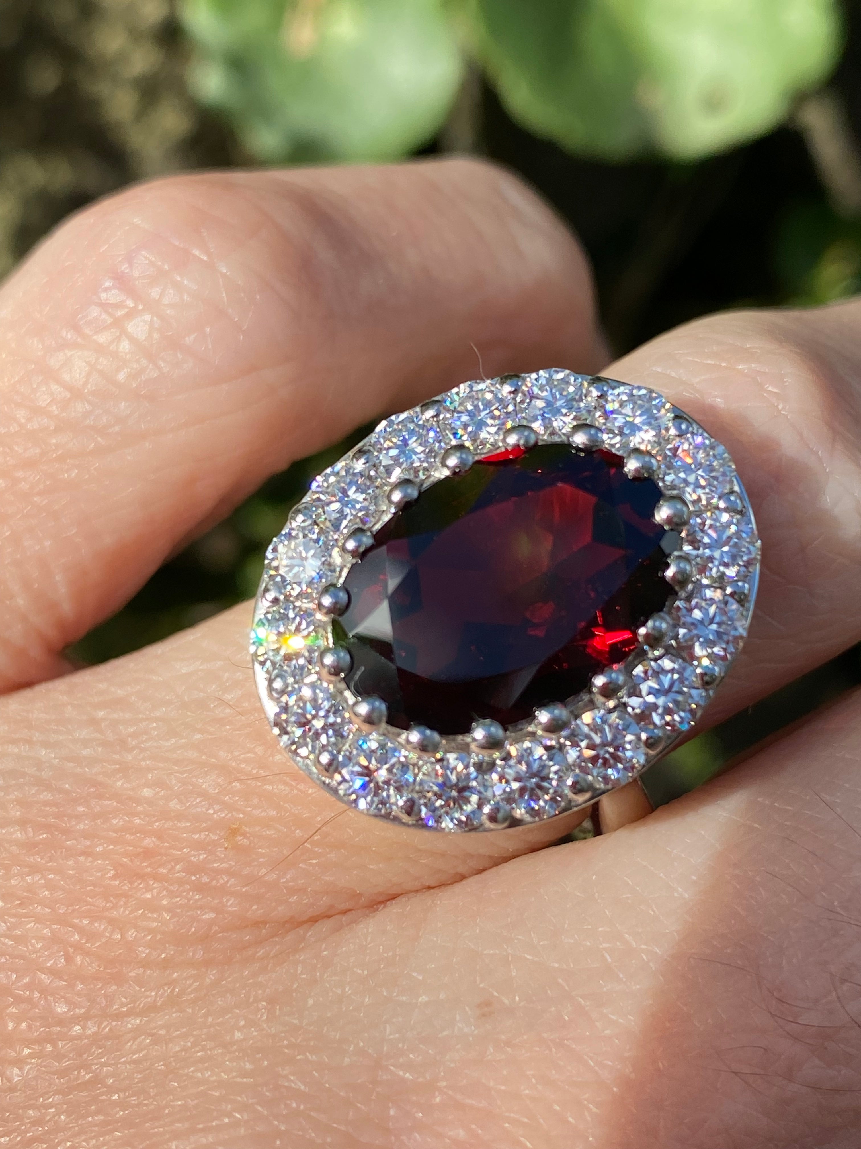 8.25 CTW Oval Cut Garnet and Moissanite Halo Cocktail Ring in Sterling Silver