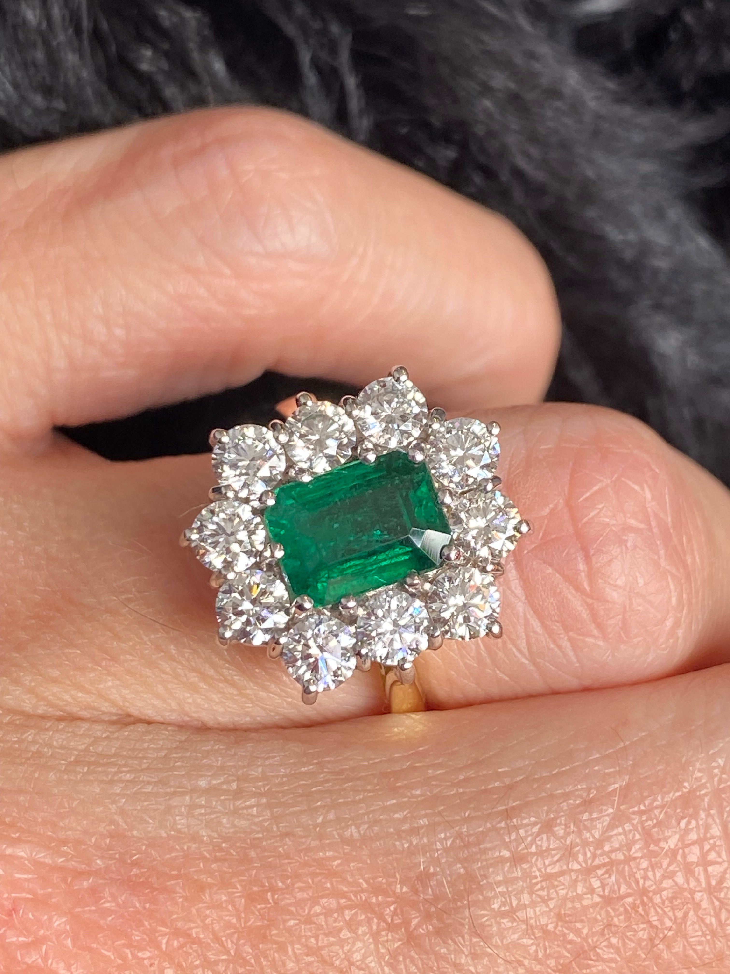 Outrageously Fantastic 4.17 CTW Emerald and Diamond Halo Ring in 18ct White and Yellow Gold