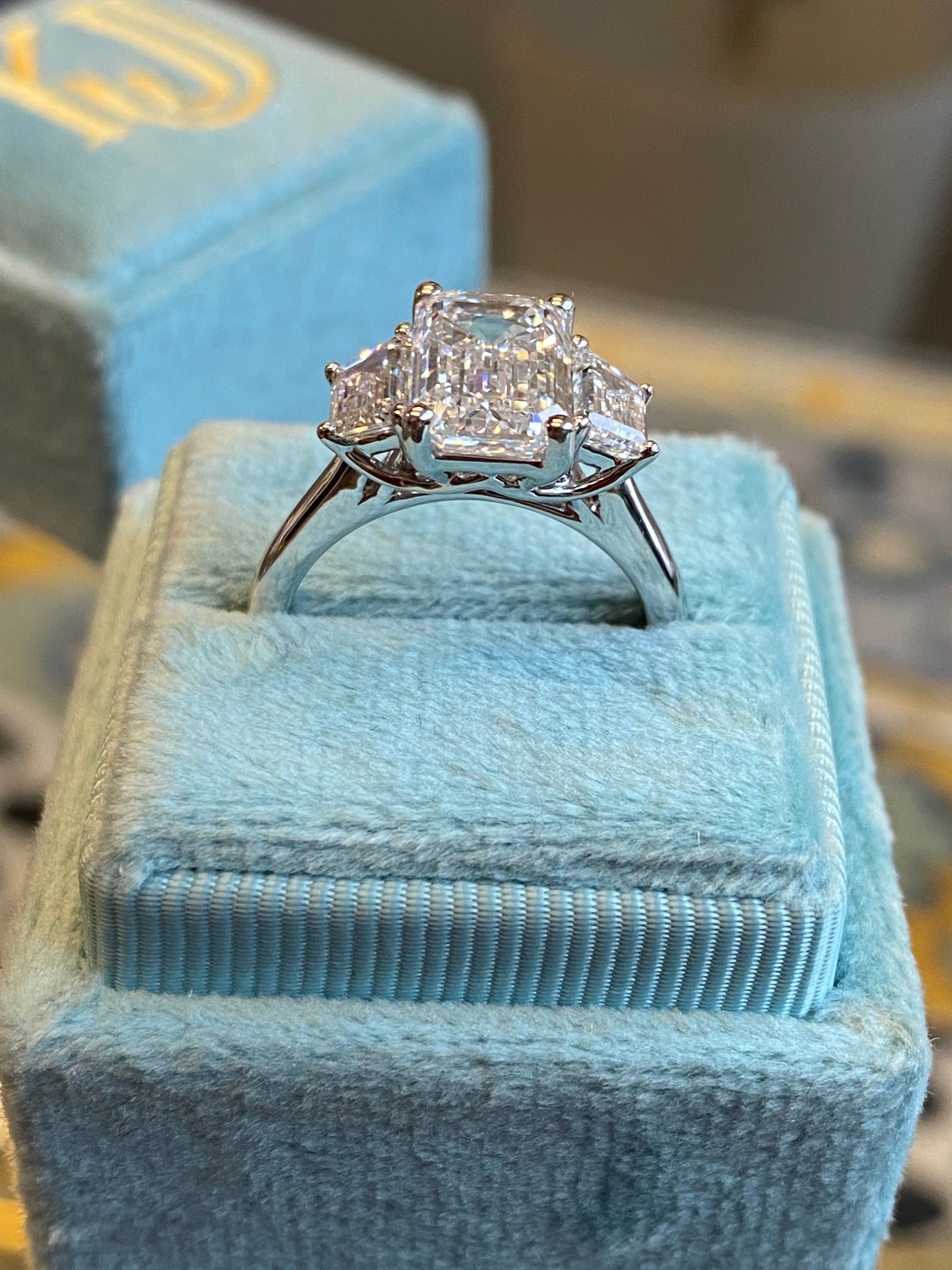 3.93 CTW Emerald and Trapezoid Cut D Colour VS1 Lab Diamond Three Stone Ring in Platinum