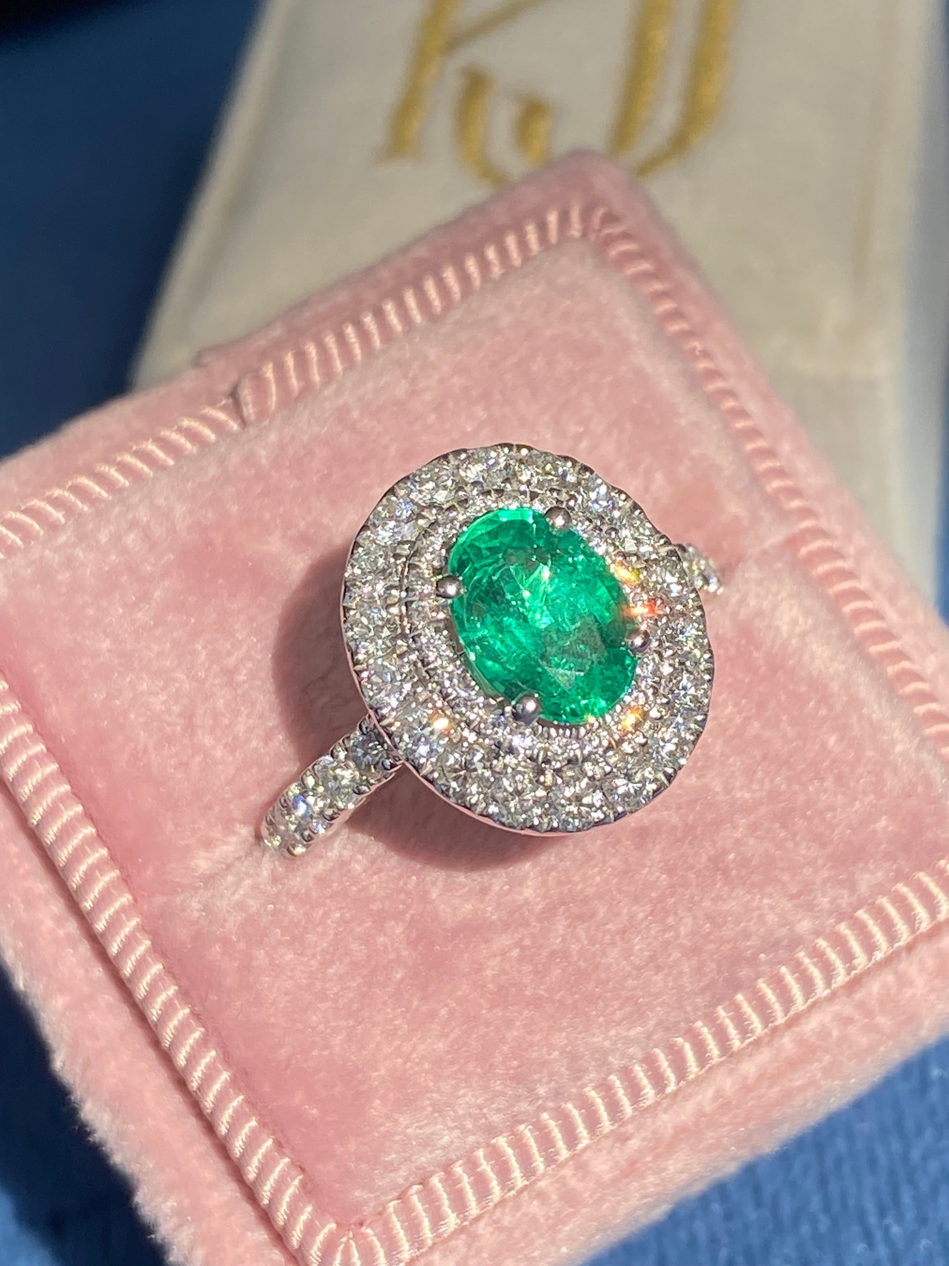 2.11 CTW Oval Cut Emerald and Natural Diamond Double Halo Ring in Platinum