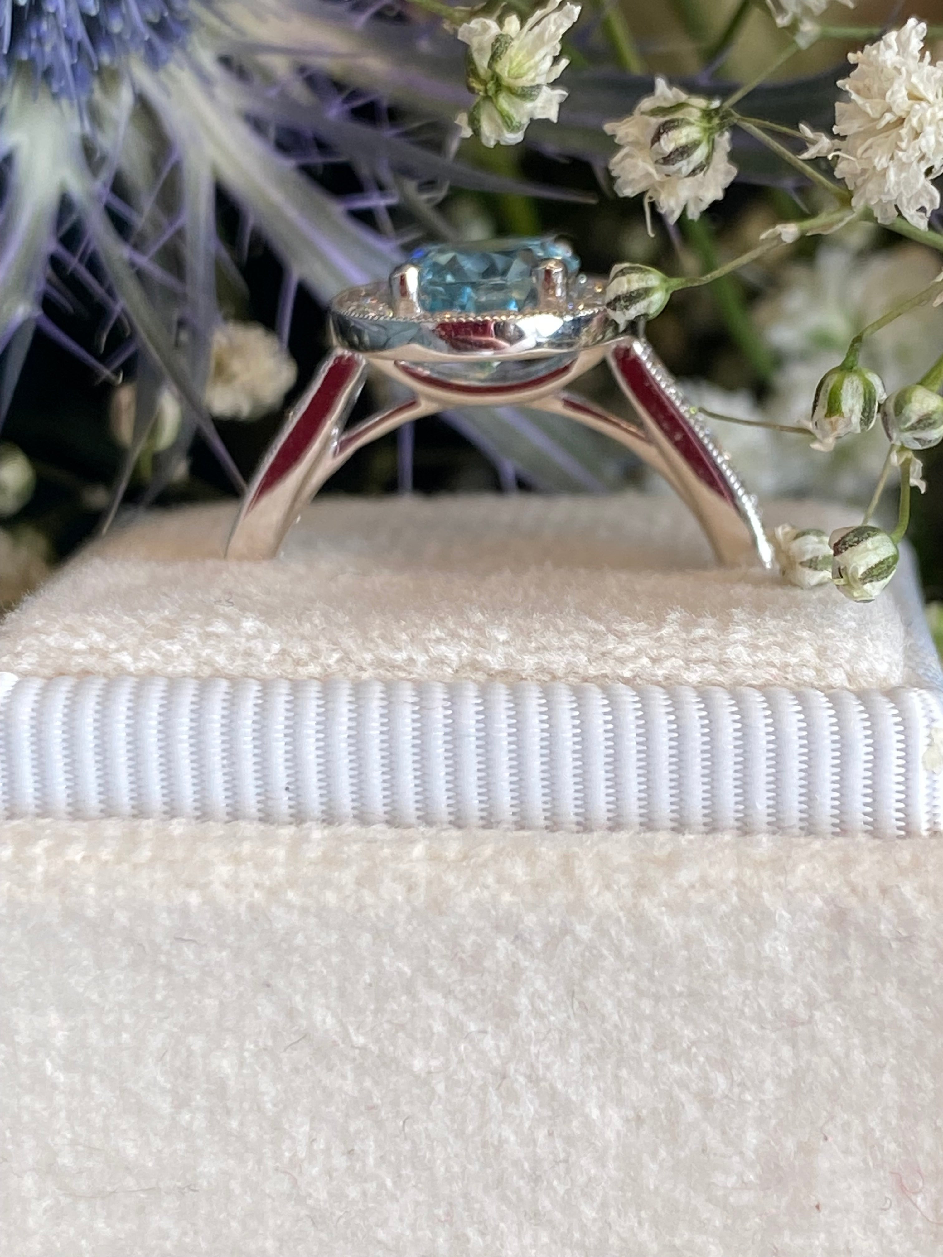 2.33 CTW Oval Cut Aquamarine and Natural Diamond Halo Engagement Ring in 18ct White Gold
