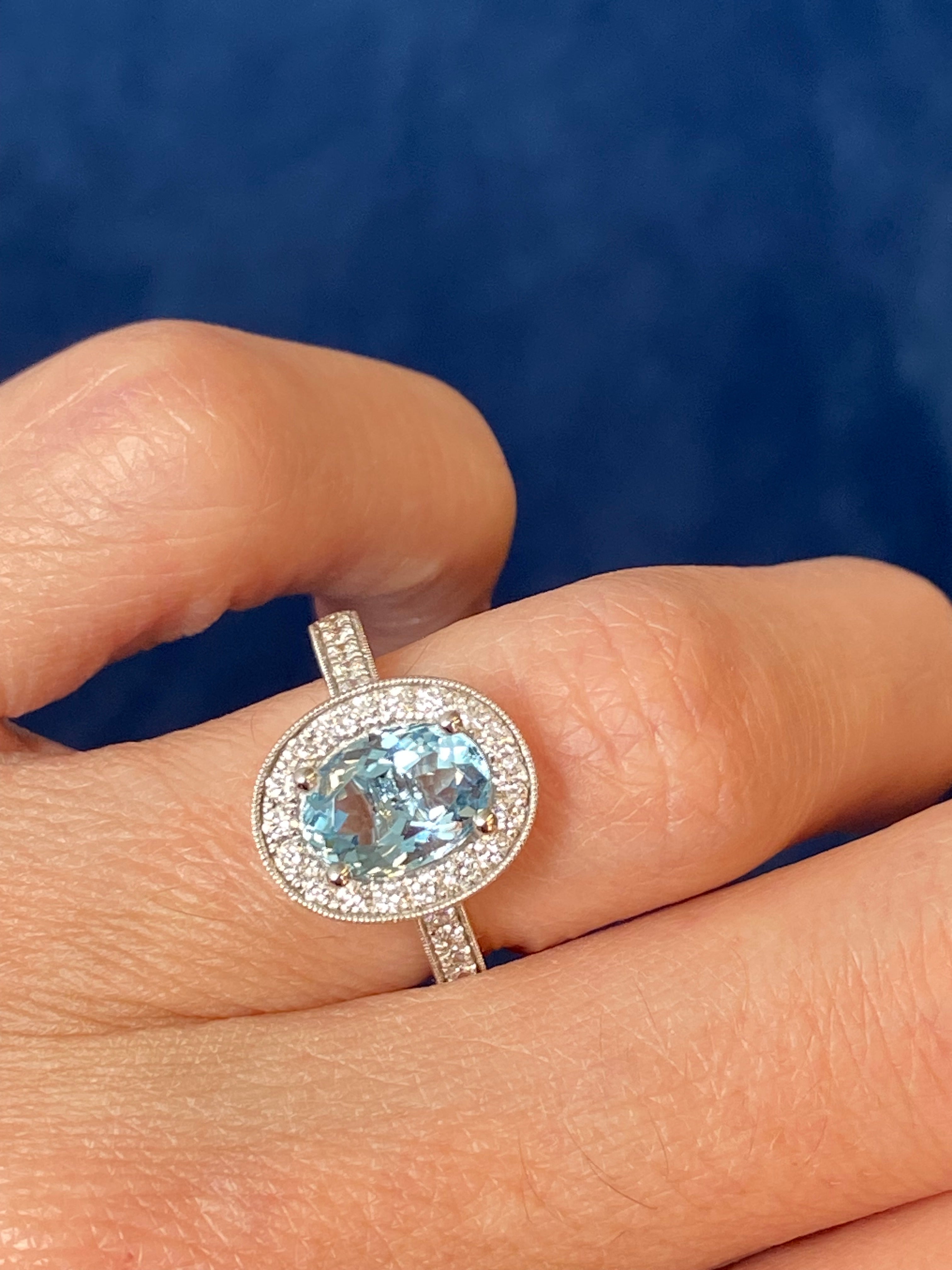 2.33 CTW Oval Cut Aquamarine and Natural Diamond Halo Engagement Ring in 18ct White Gold