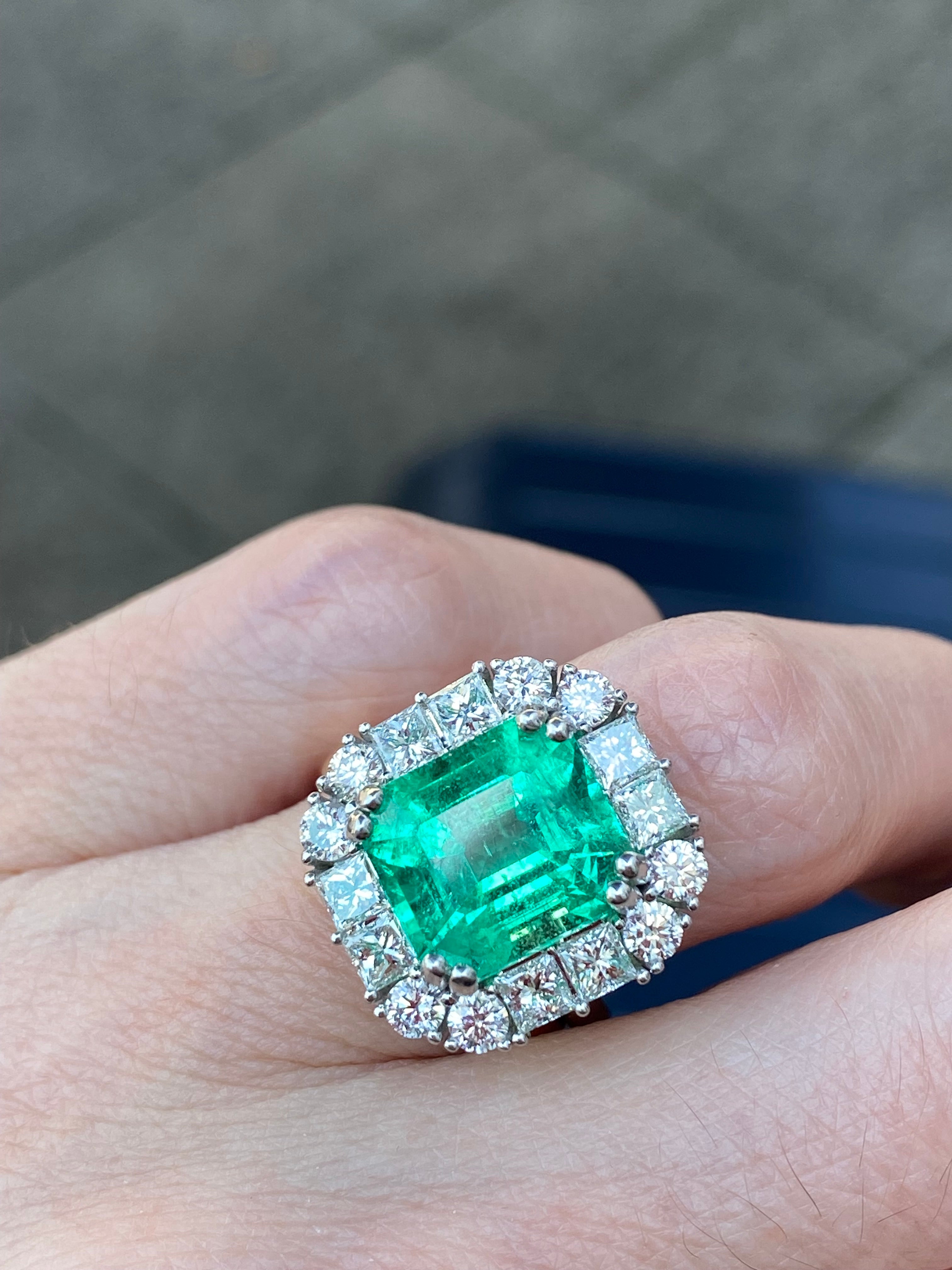 5.92 Carat Emerald Cut Colombian Emerald and Diamond Halo Ring in Platinum