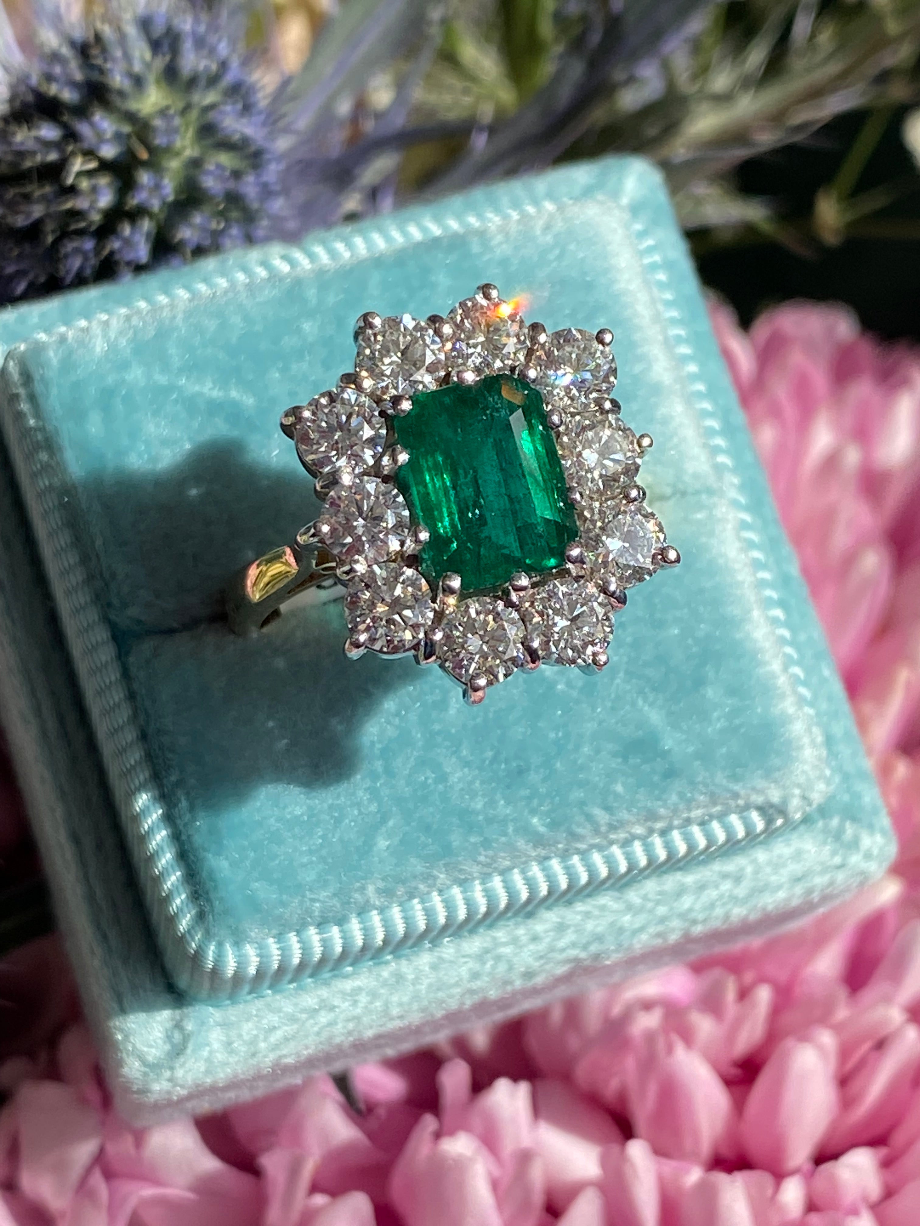 Outrageously Fantastic 4.17 CTW Emerald and Diamond Halo Ring in 18ct White and Yellow Gold