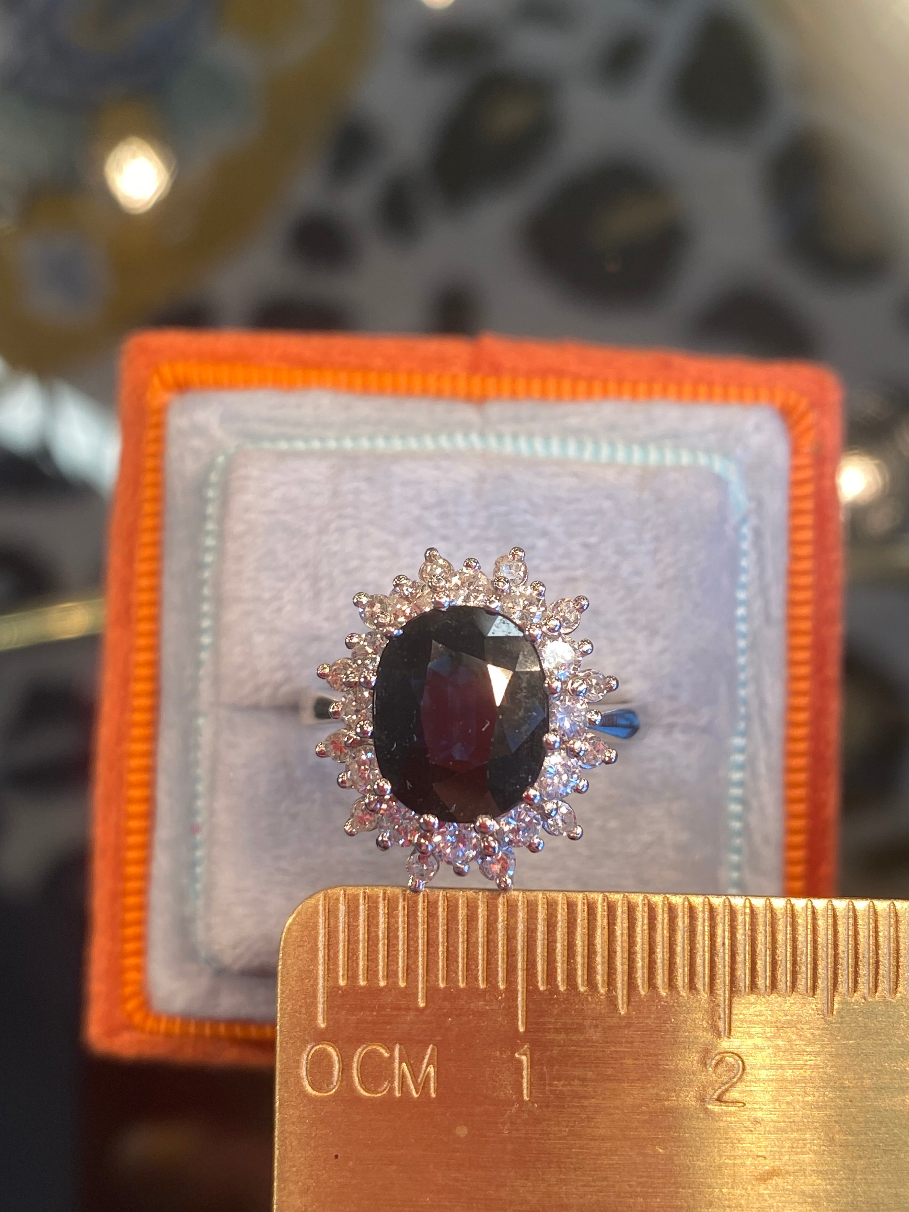 2.75 Carat Oval Blue Sapphire and 1.00 Carat Diamond Halo Ring in 18ct White Gold