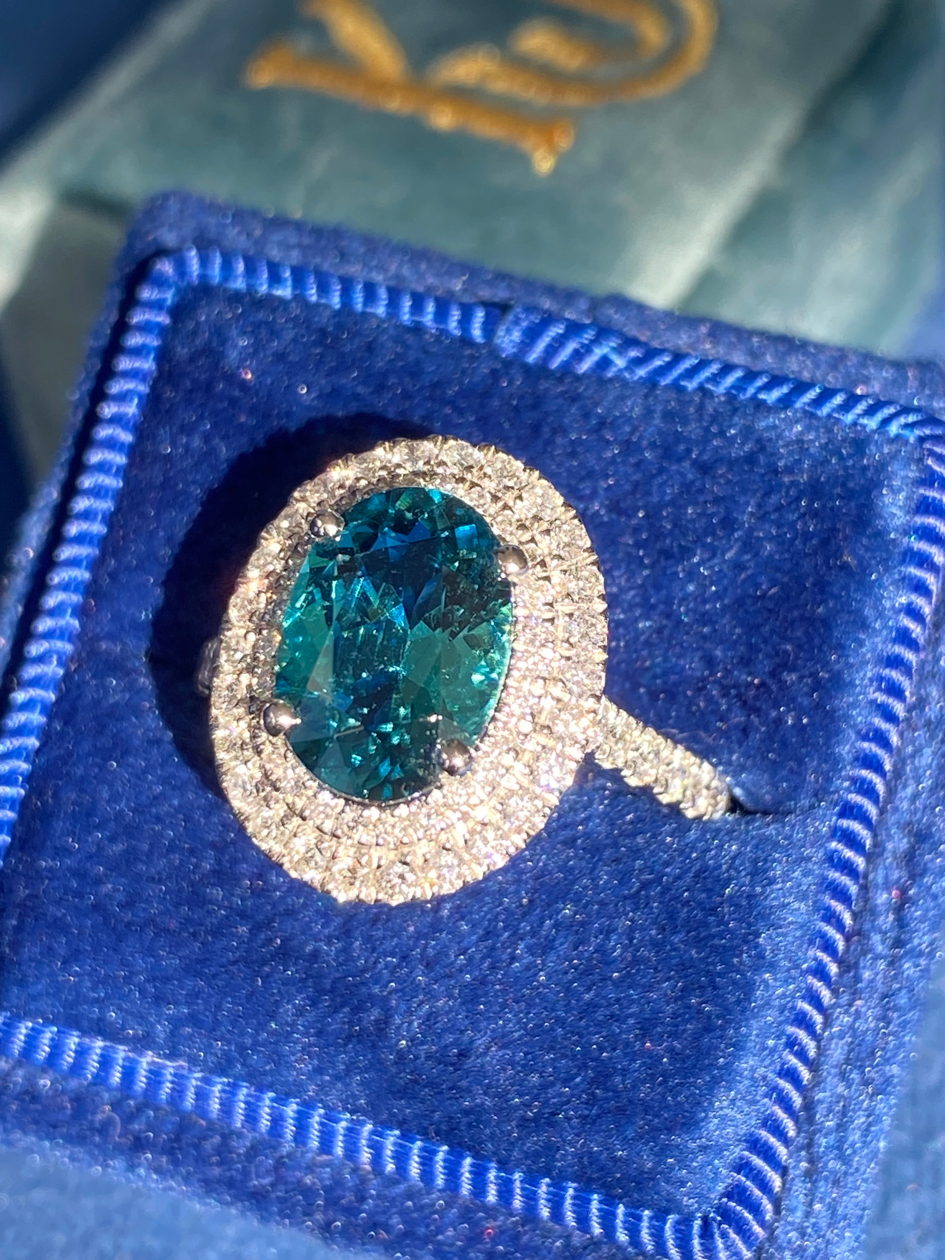 2.43 Carat Lagoon Tourmaline and Natural Diamond Double Halo Ring in Platinum