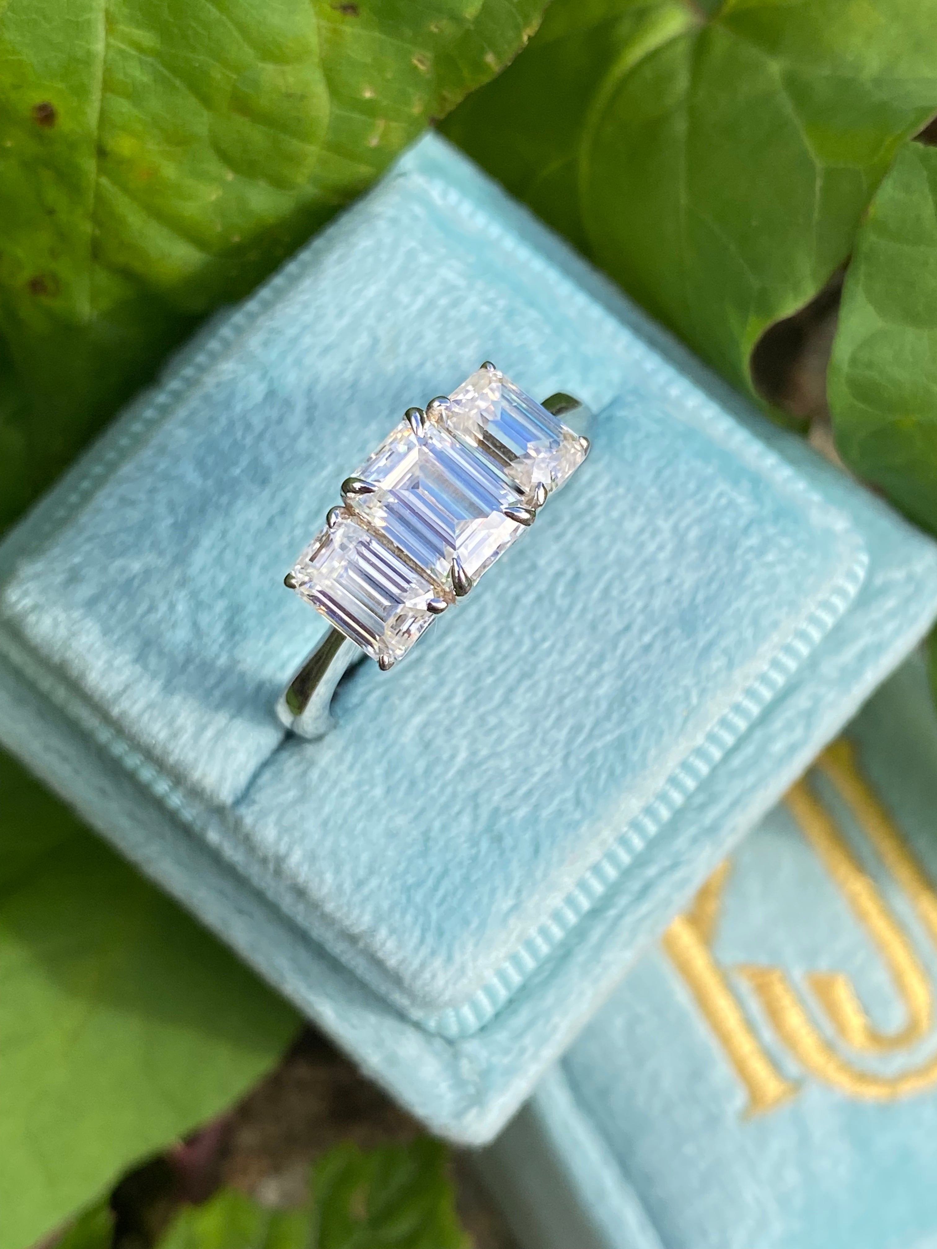 2.00 CTW Emerald Cut Moissanite Three Stone Engagement Ring in Sterling Silver