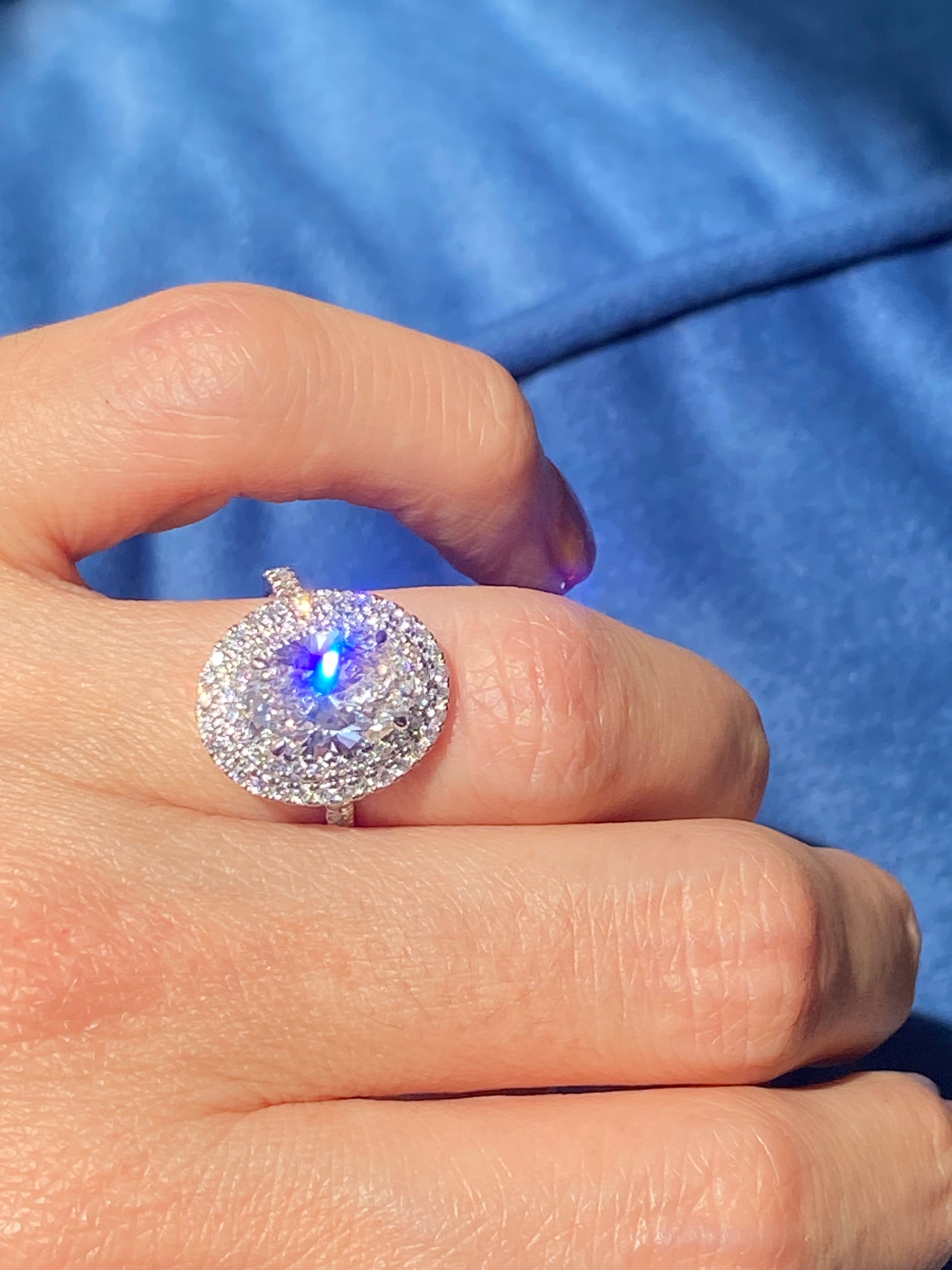 3.92 CTW Oval Cut Lab Diamond Double Halo Engagement Ring in Platinum