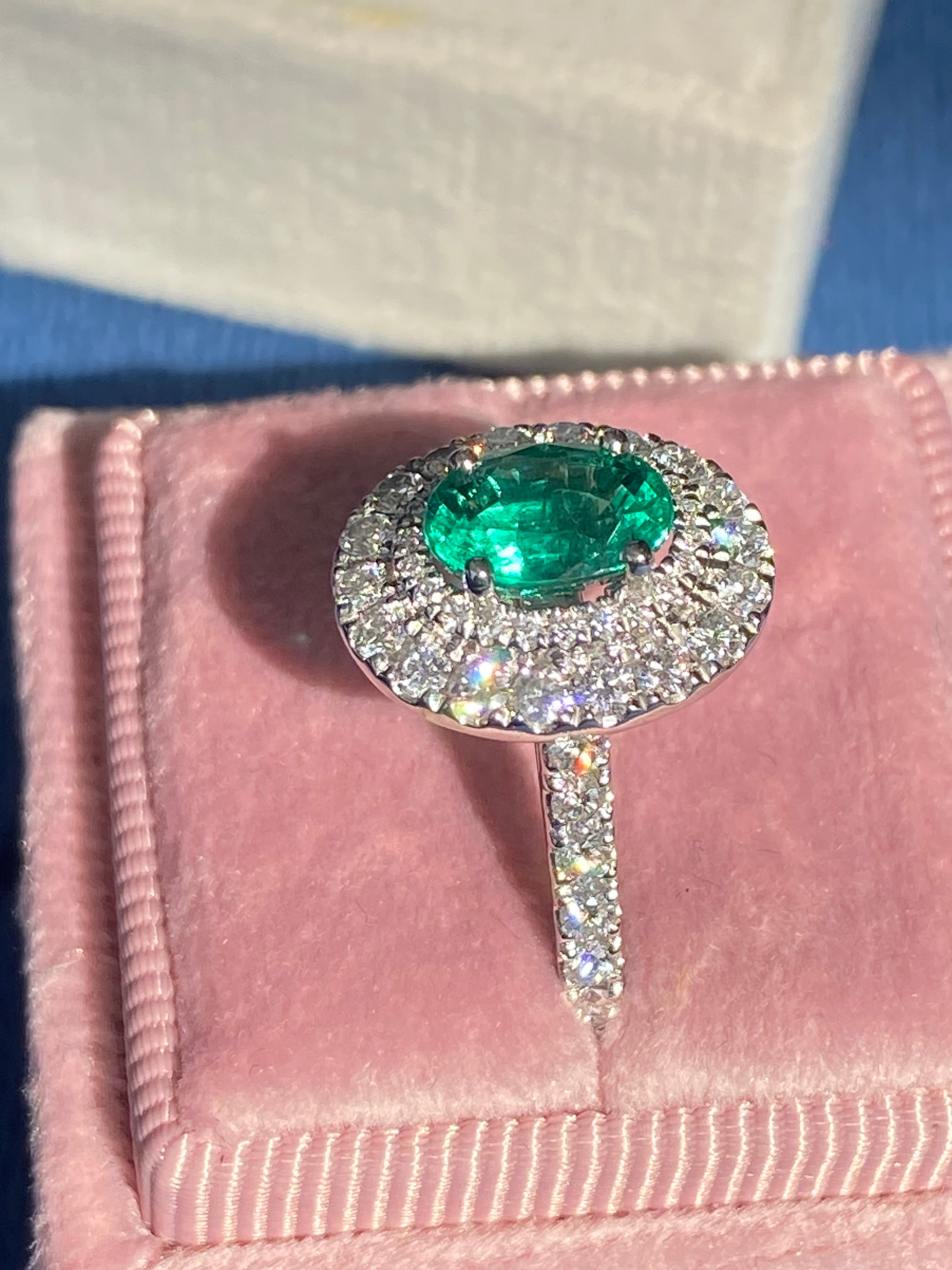 2.11 CTW Oval Cut Emerald and Natural Diamond Double Halo Ring in Platinum