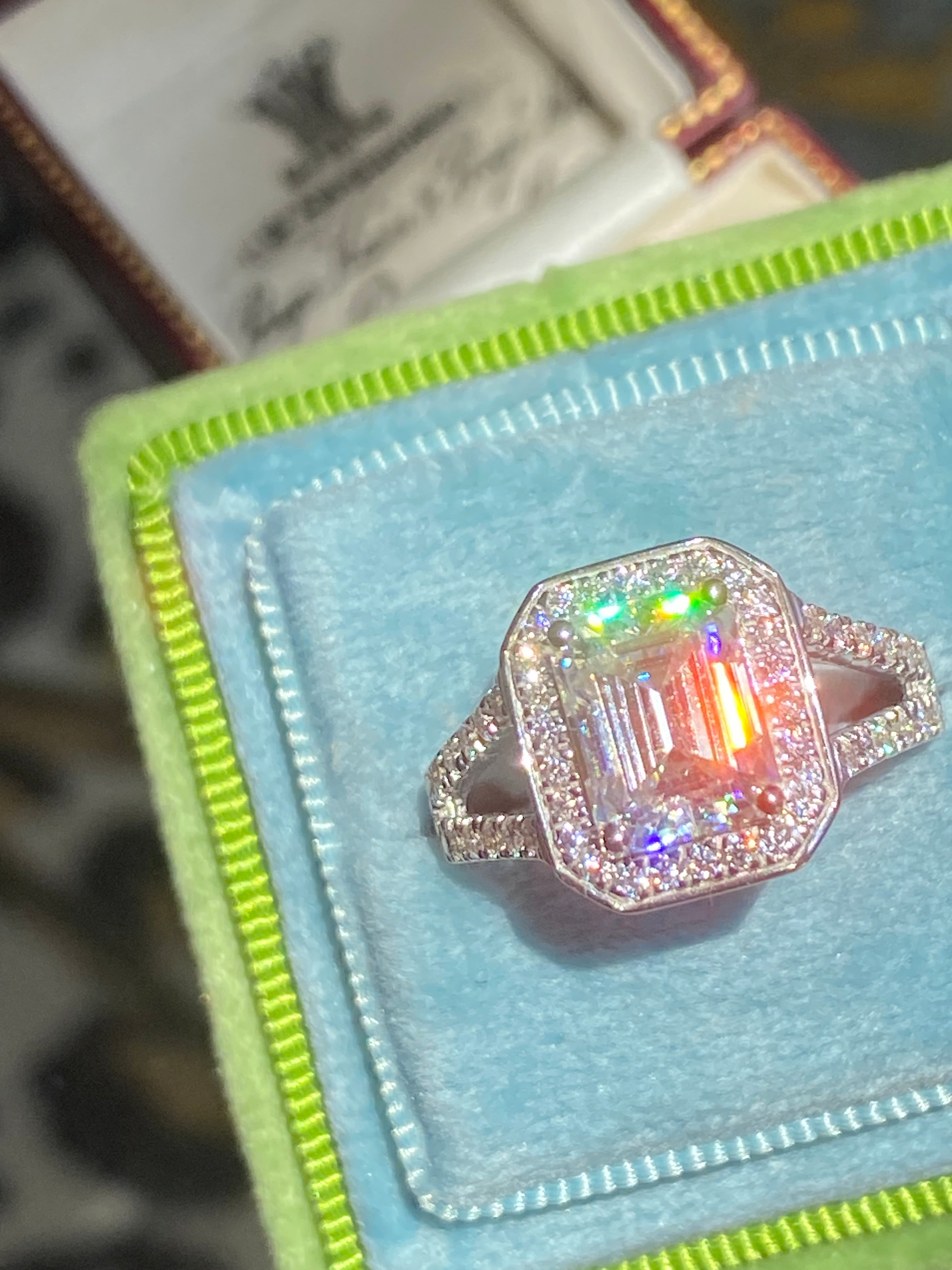 3.10 CTW Emerald Cut Moissanite Halo Ring in Sterling Silver