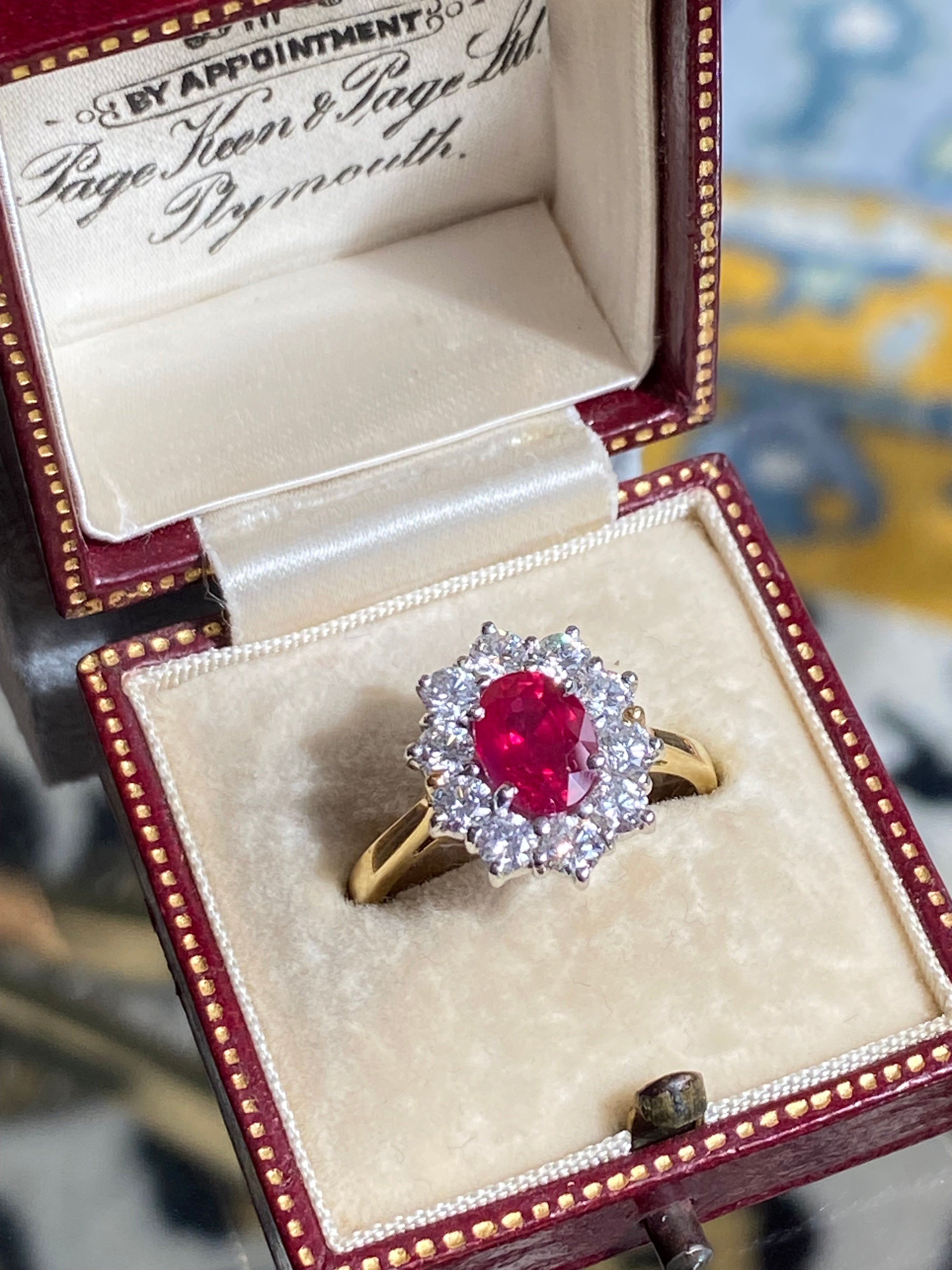 Breathtaking Ruby and Natural Diamond Halo Ring in 18ct Gold