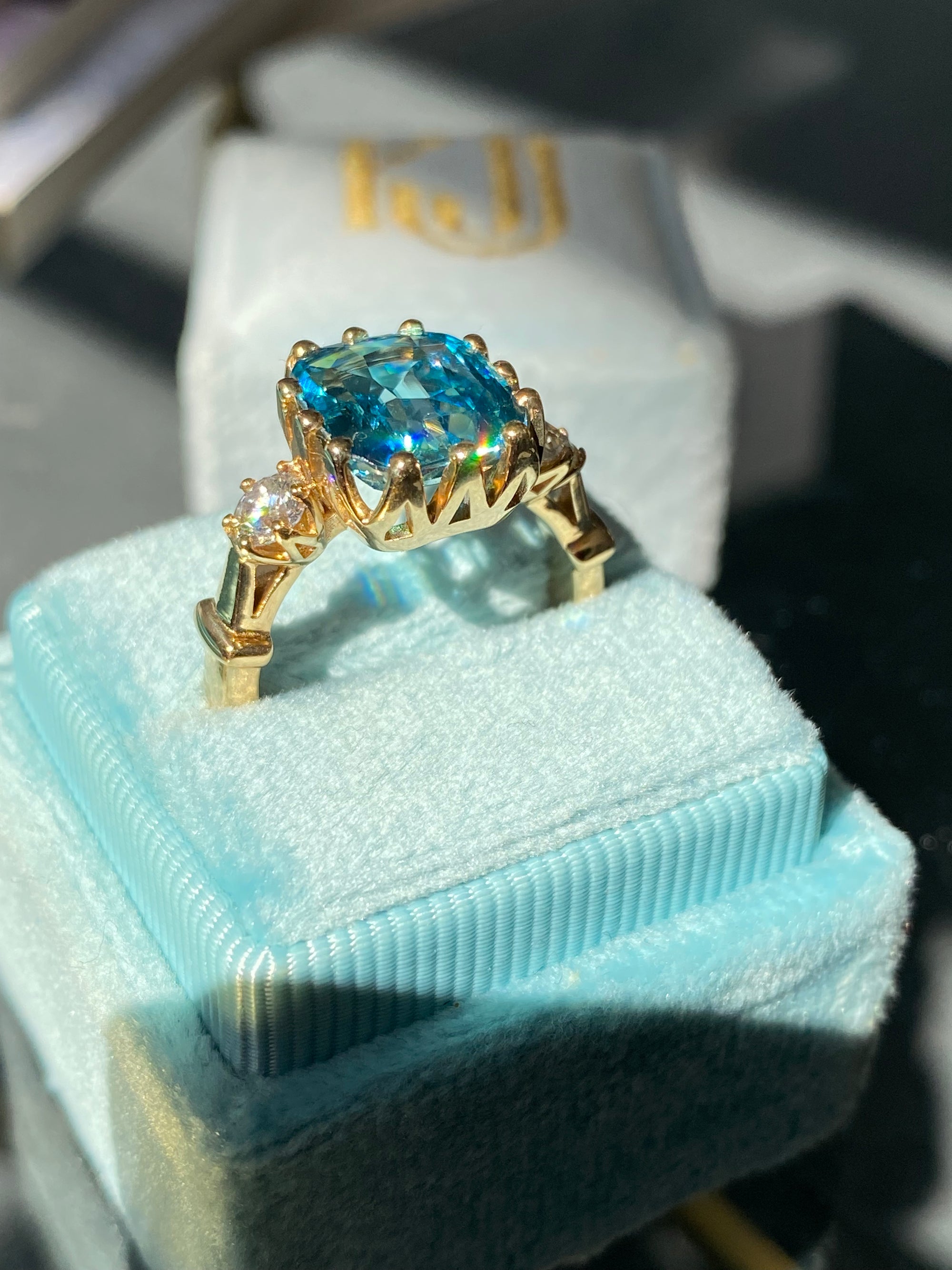 6.75 Carat Blue Zircon and Diamond Three Stone Ring in 18ct Yellow Gold