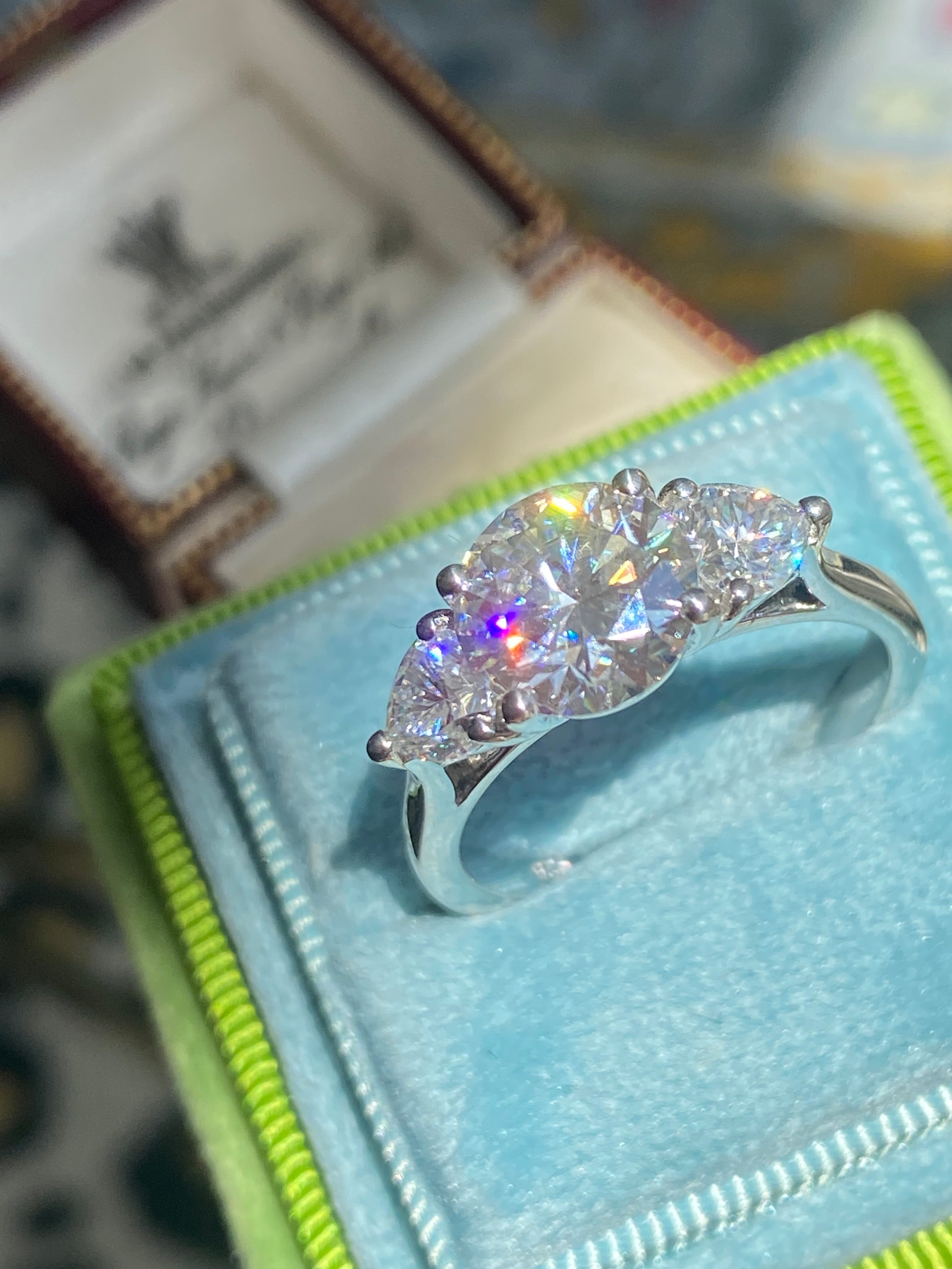 3.40 CTW Round and Heart Shape Moissanite Three Stone Ring in Sterling Silver