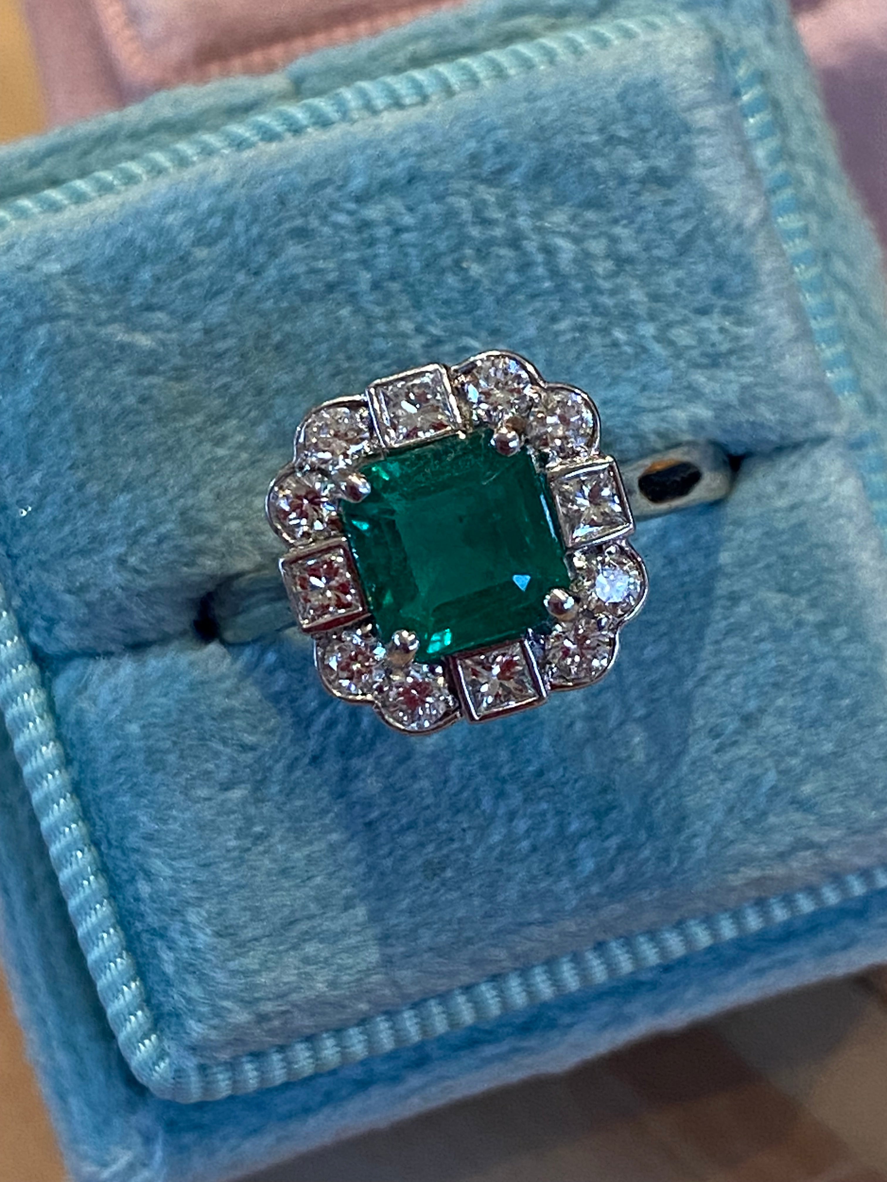 1.35 Carat Emerald Cut Emerald and 0.49 CTW Natural Diamond Halo Ring in Platinum