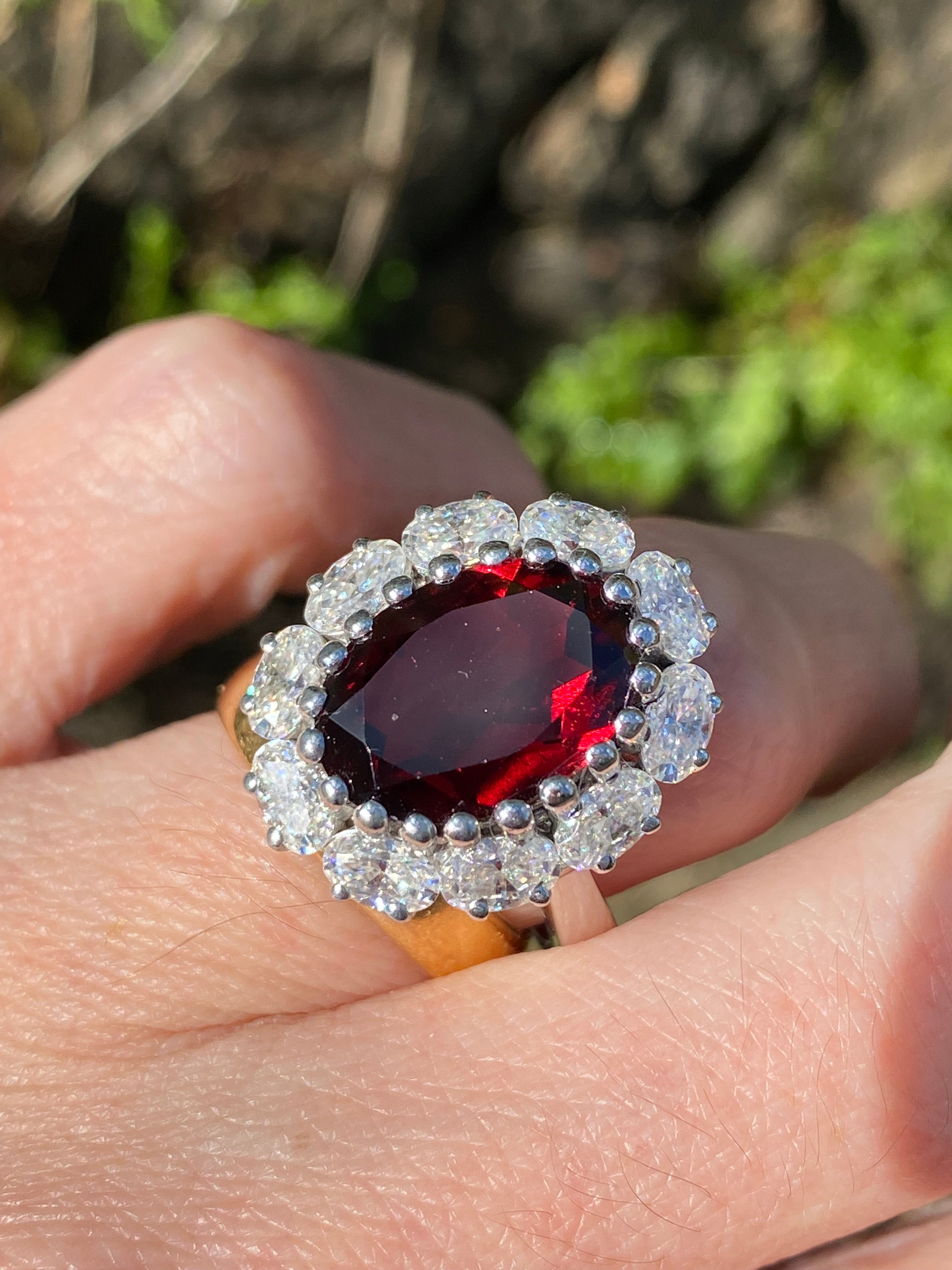 8.17 CTW Oval Cut Garnet and Moissanite Halo Cocktail Ring